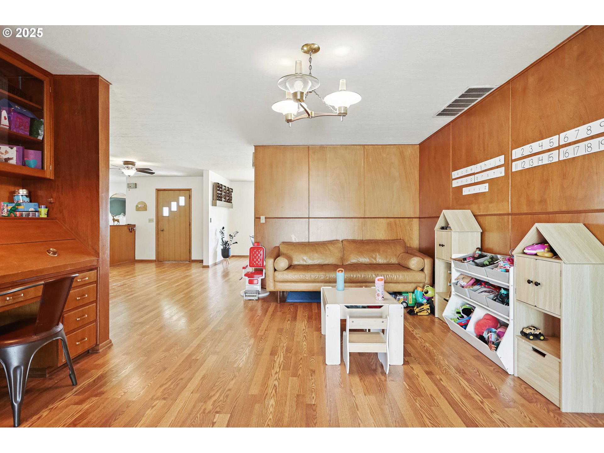 236 N Mill Grass Valley, OR 97029 - Photo 19 of 45 a living room with furniture and a chandelier