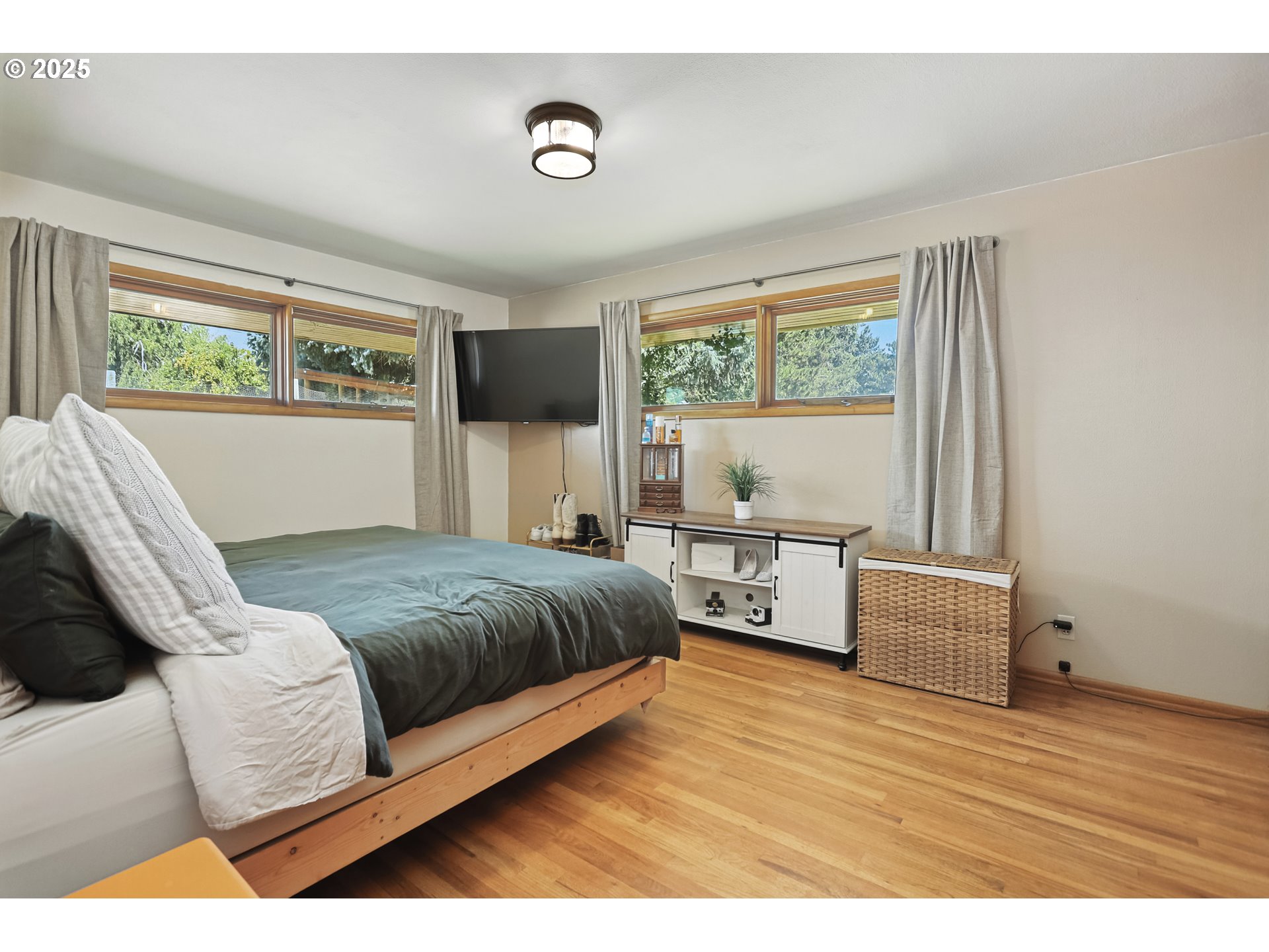 236 N Mill Grass Valley, OR 97029 - Photo 21 of 45 a bedroom with a large bed and a couch