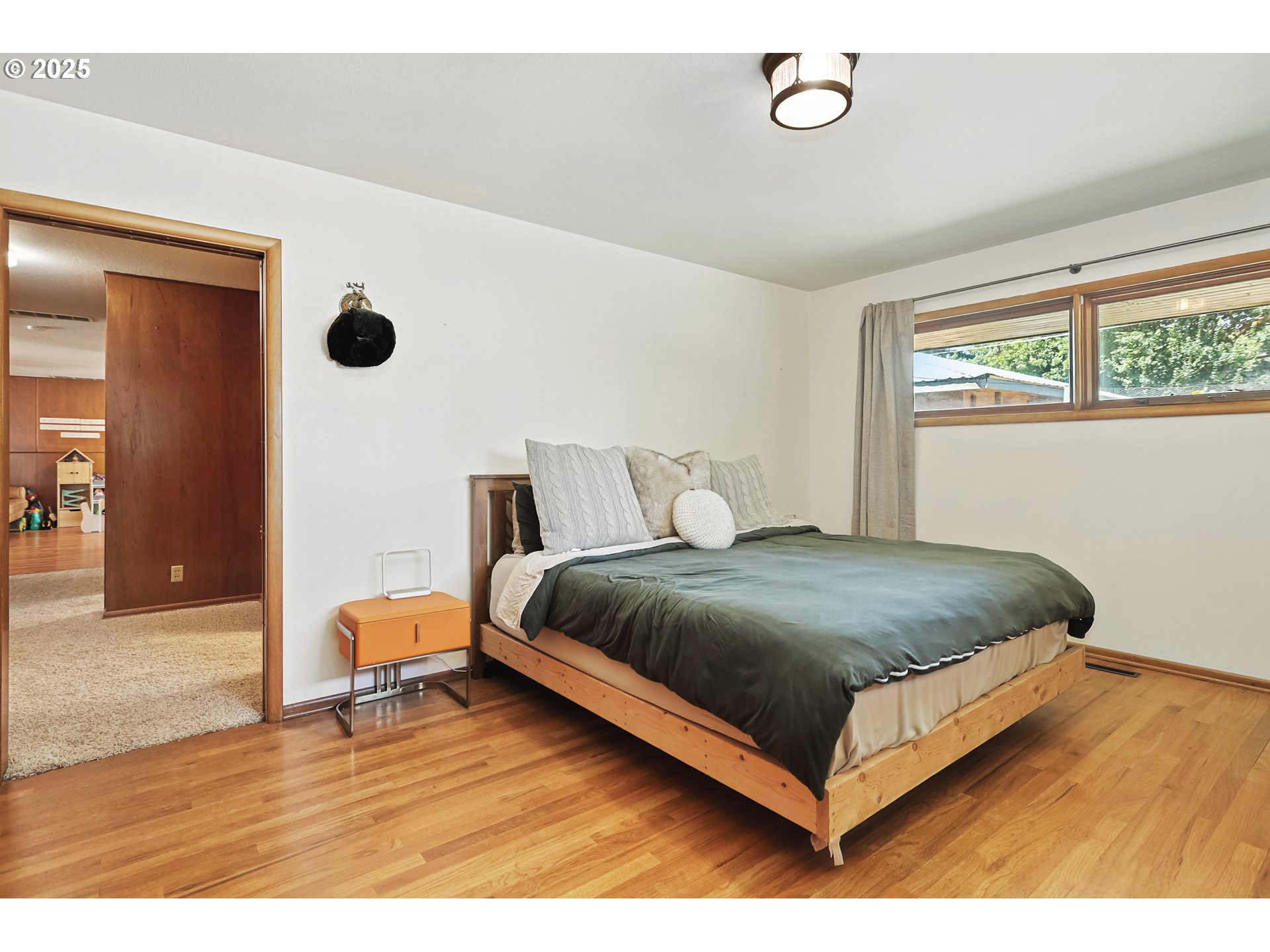 236 N Mill Grass Valley, OR 97029 - Photo 22 of 45 a bedroom with a bed lamp and a large window