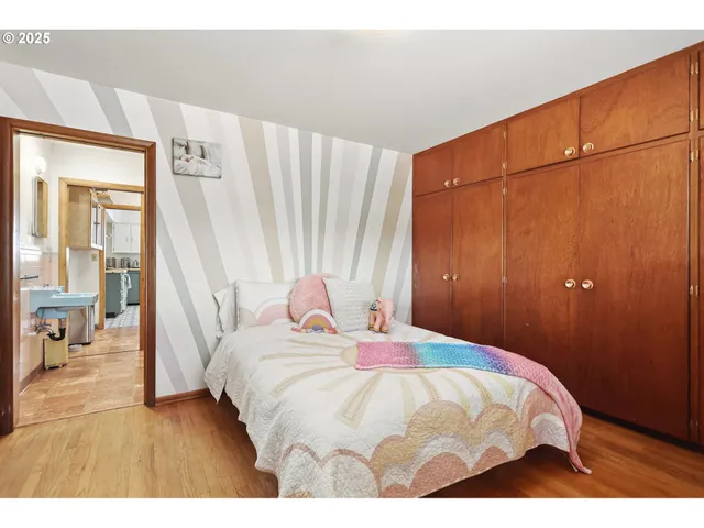 a bedroom with a bed and a table