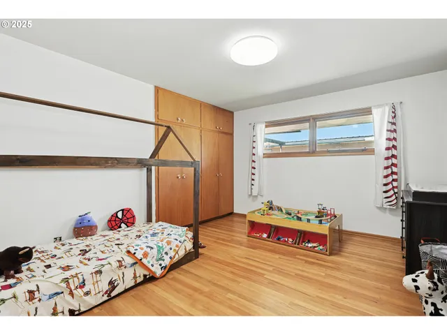 a bedroom with bed and a dresser