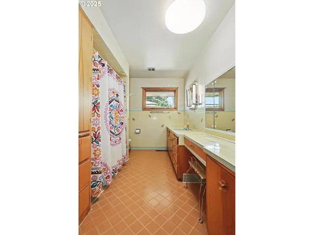 a bathroom with a sink a vanity and a mirror