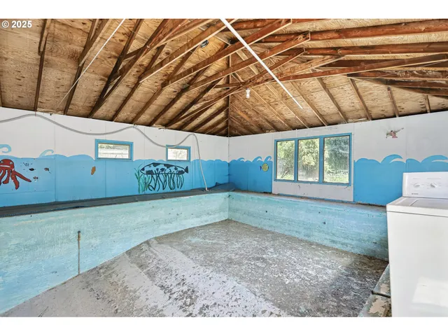 a view of a backyard that has a tree