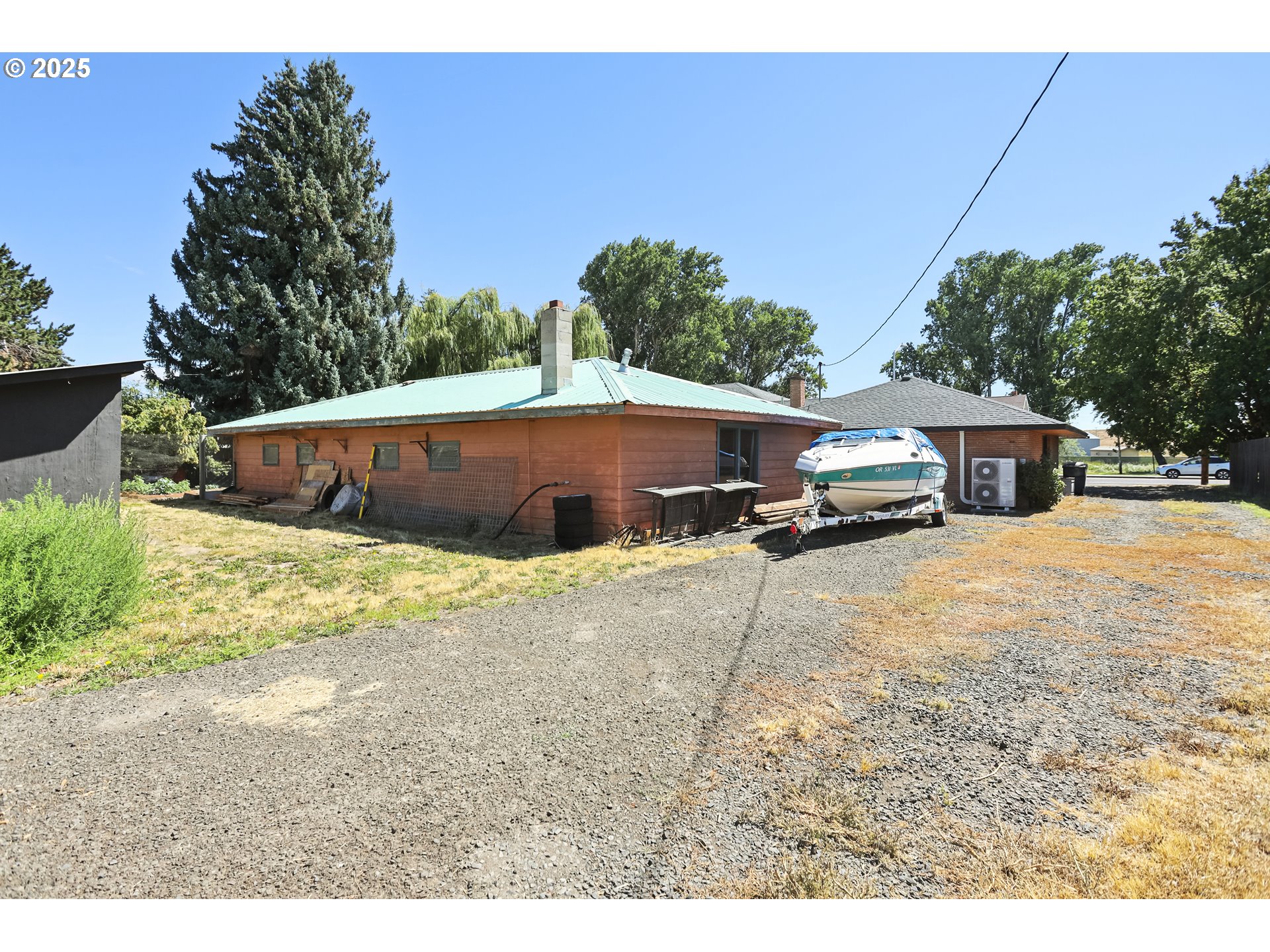 236 N Mill Grass Valley, OR 97029 - Photo 39 of 45 a view of a house with a yard and sitting area