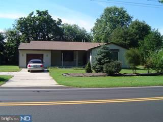 1830 Almonesson Road Woodbury, NJ 08096 - Photo 1 of 6 a front view of a house with a garden and trees