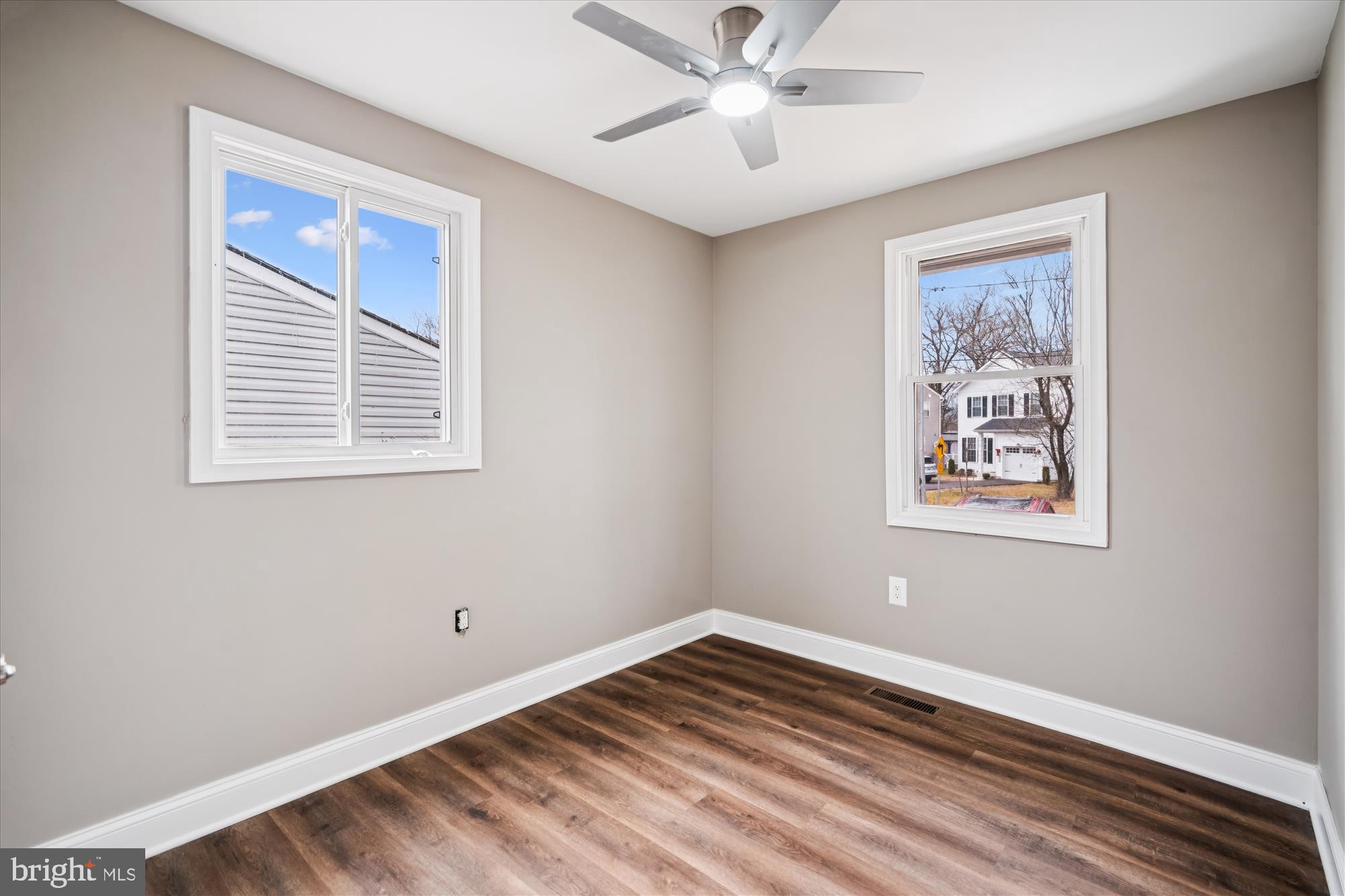 6473 Anderson Avenue Hanover, MD 21076 - Photo 12 of 27 a view of an empty room with a window and a painting on the wall