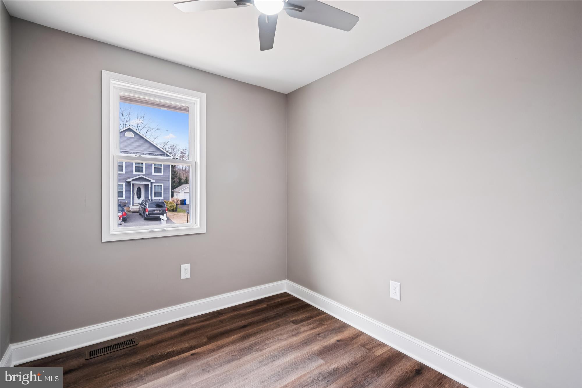 6473 Anderson Avenue Hanover, MD 21076 - Photo 13 of 27 a view of an empty room with wooden floor and a window