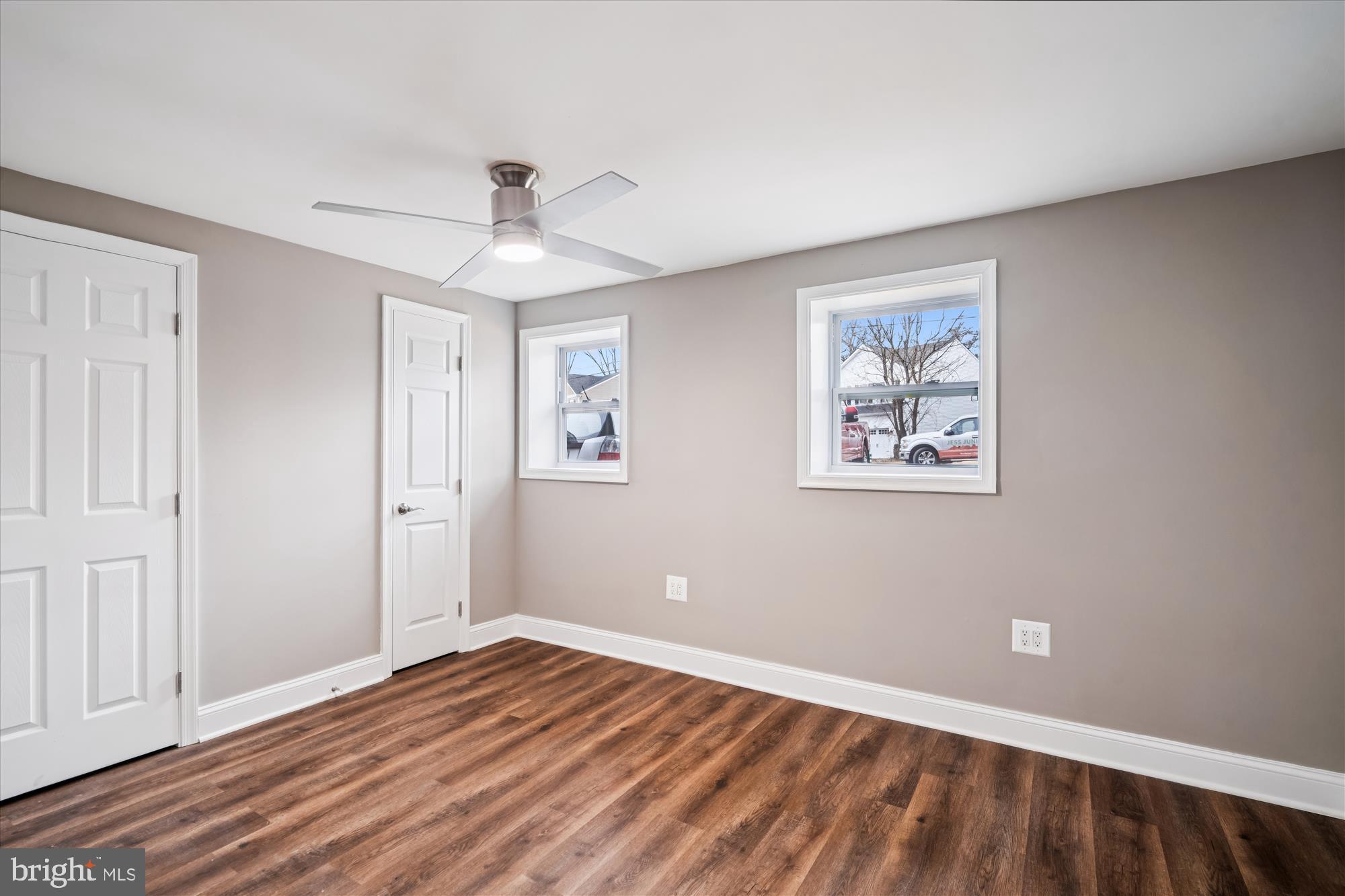 6473 Anderson Avenue Hanover, MD 21076 - Photo 17 of 27 a view of empty room with wooden floor and ceiling fan