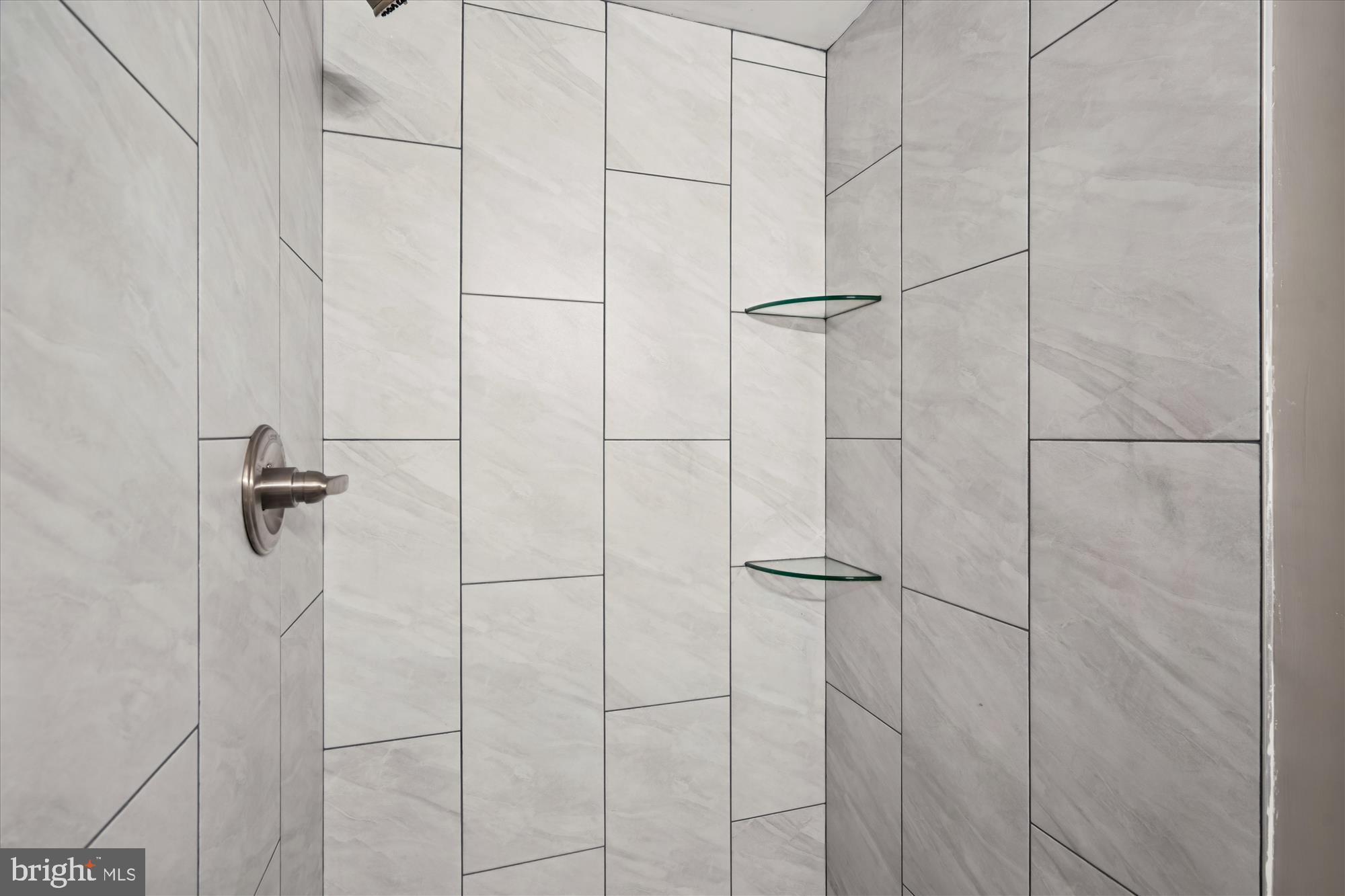 6473 Anderson Avenue Hanover, MD 21076 - Photo 18 of 27 a bathroom with a shower