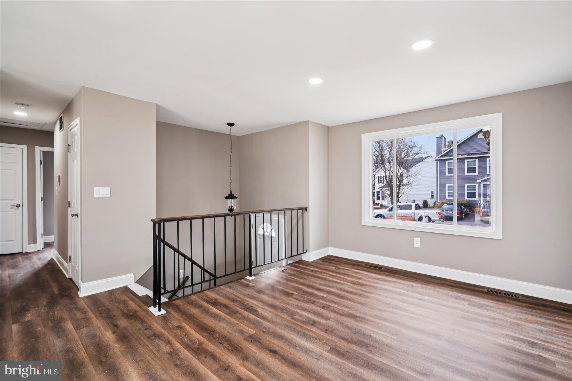 6473 Anderson Avenue Hanover, MD 21076 - Photo 4 of 27 a view of a room with wooden floor window and staircase