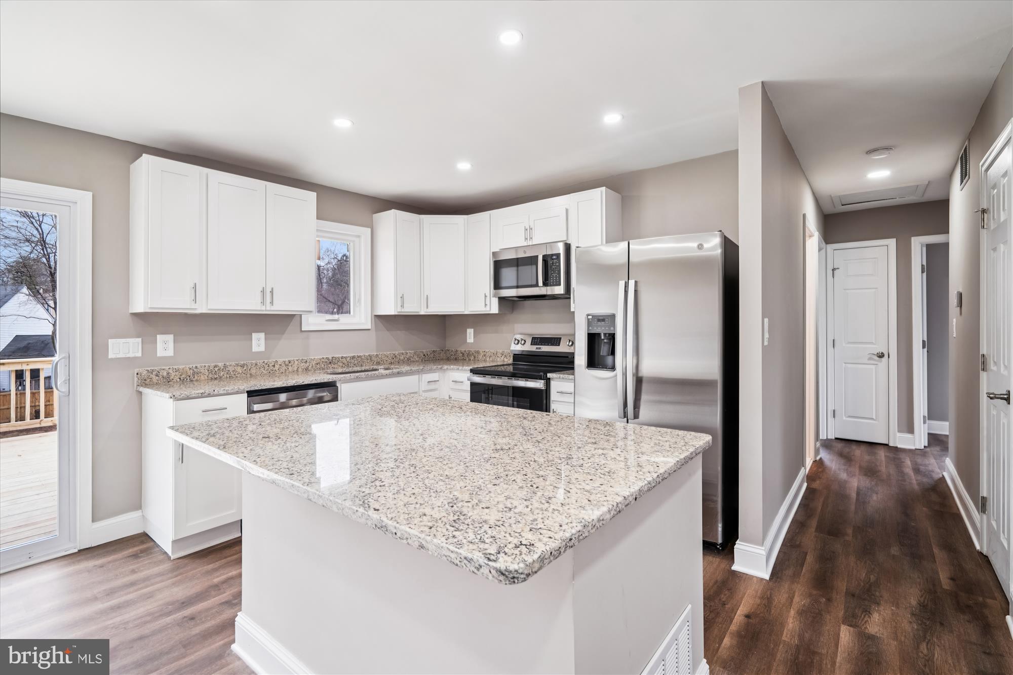 6473 Anderson Avenue Hanover, MD 21076 - Photo 6 of 27 a kitchen with stainless steel appliances granite countertop a refrigerator a stove and a sink