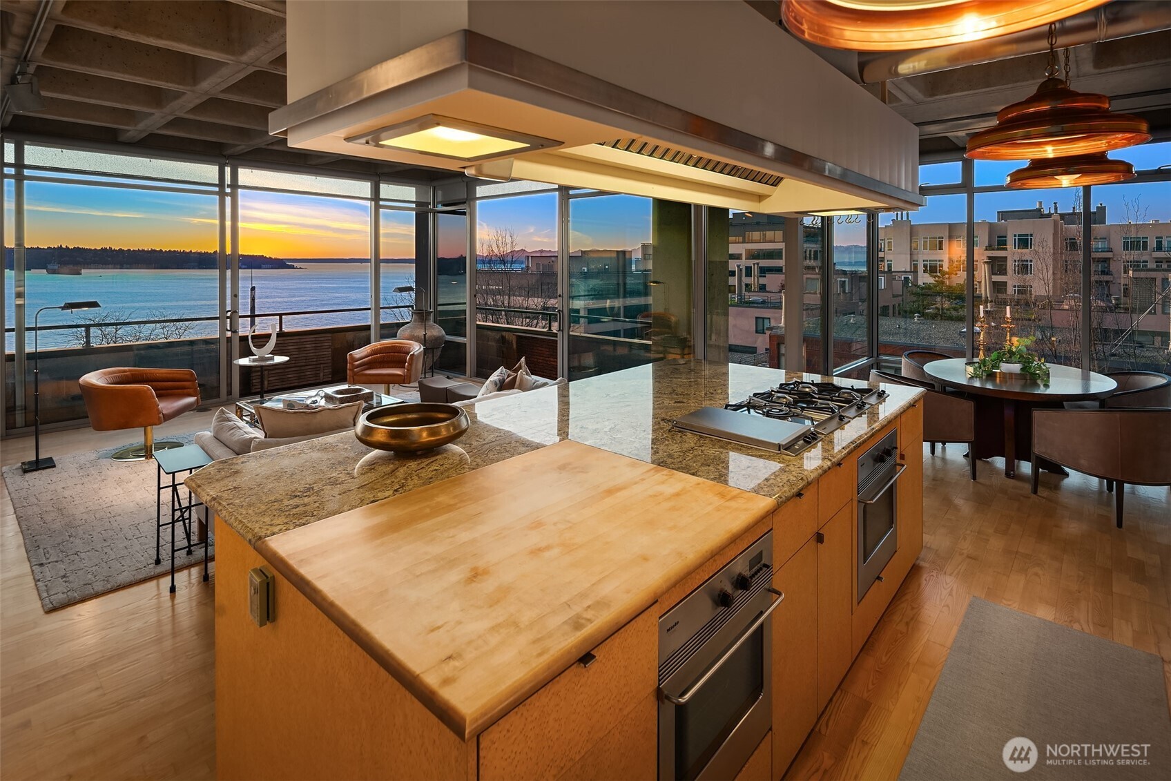 87 Virginia Street, Unit 8 Seattle, WA 98101 - Photo 11 of 34 a view of a kitchen with a sink and wooden floor