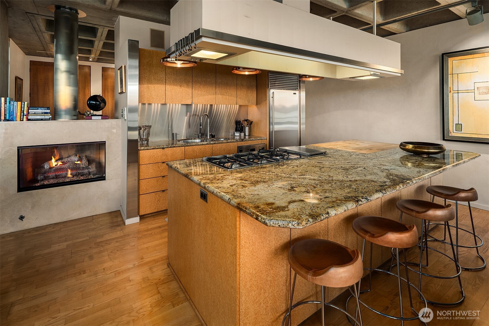 87 Virginia Street, Unit 8 Seattle, WA 98101 - Photo 13 of 34 a kitchen with kitchen island granite countertop a stove and a sink