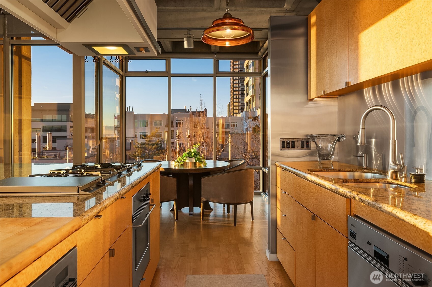 87 Virginia Street, Unit 8 Seattle, WA 98101 - Photo 16 of 34 a view of a kitchen with a large window and furniture
