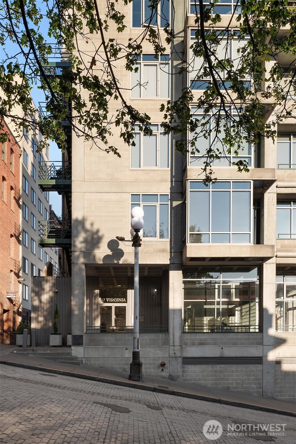 87 Virginia Street, Unit 8 Seattle, WA 98101 - Photo 24 of 34 a street sign on a pole on a street