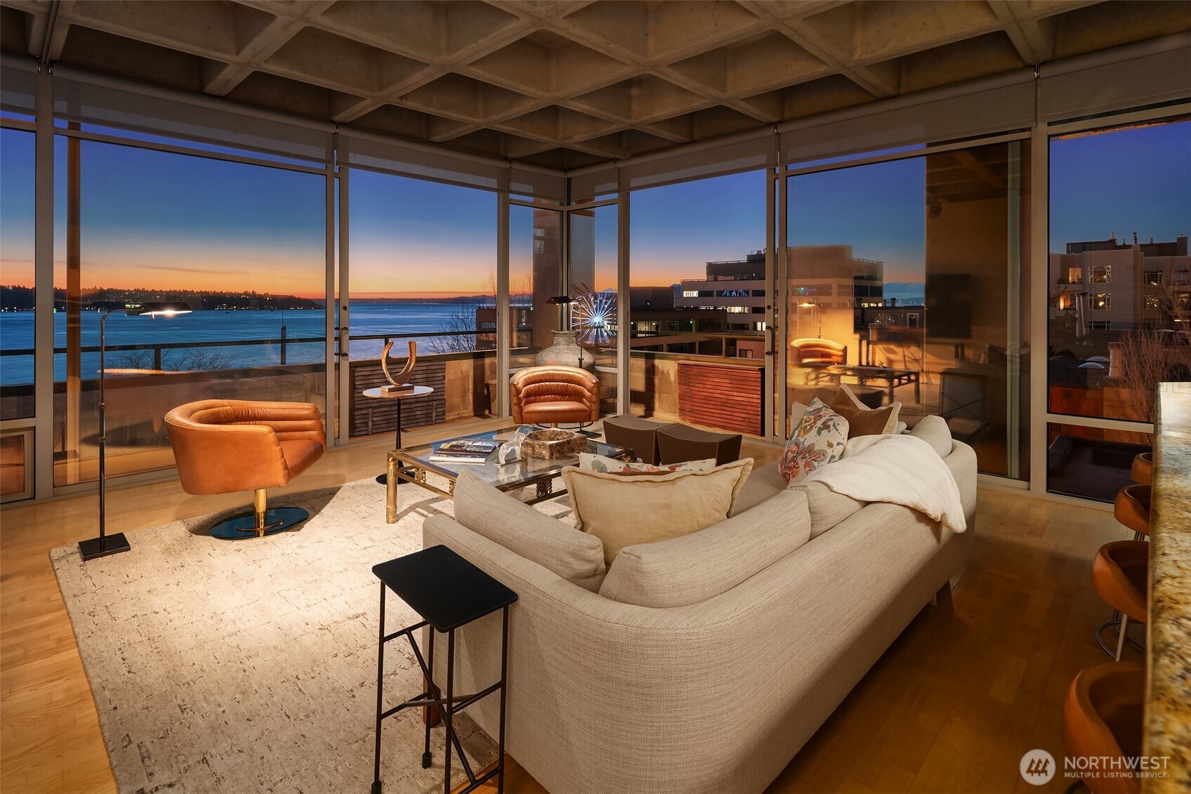 87 Virginia Street, Unit 8 Seattle, WA 98101 - Photo 5 of 34 a view of a couches and dinning table and chairs in patio