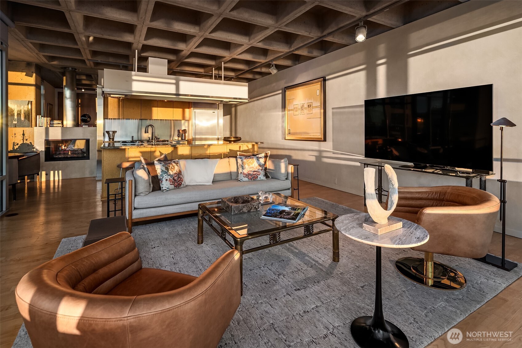 87 Virginia Street, Unit 8 Seattle, WA 98101 - Photo 9 of 34 a living room with furniture and a flat screen tv
