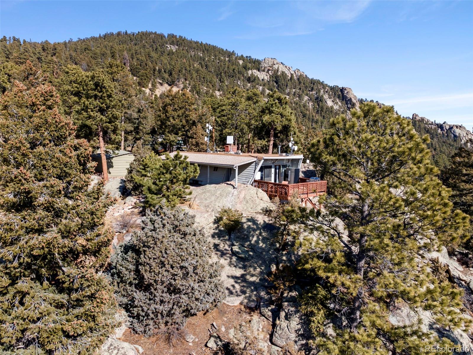 25874 Mosier Street Conifer, CO 80433 - Photo 1 of 45 a view of a house with a yard