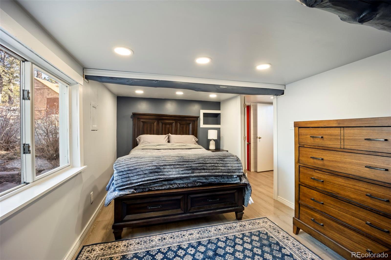 25874 Mosier Street Conifer, CO 80433 - Photo 16 of 45 a bedroom with a bed and a window