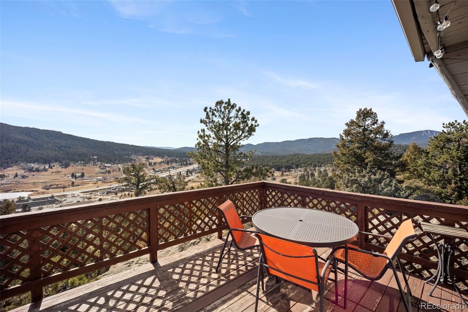 25874 Mosier Street Conifer, CO 80433 - Photo 21 of 45 a view of a balcony with mountain view and wooden floor