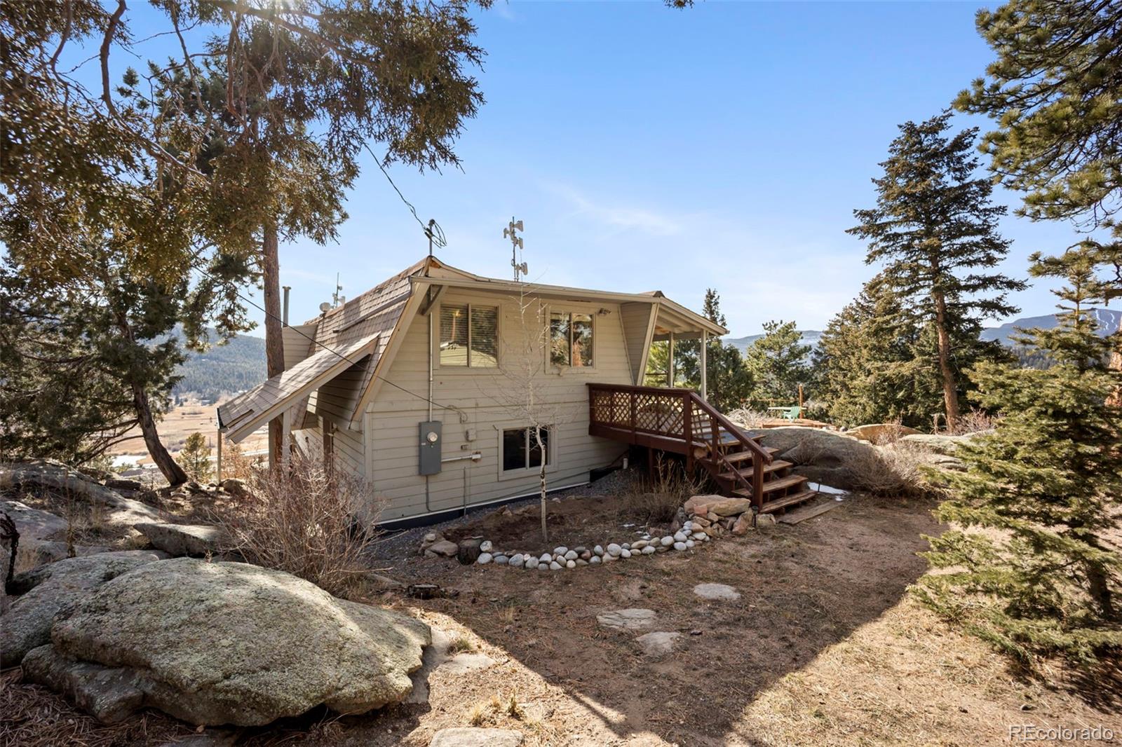 25874 Mosier Street Conifer, CO 80433 - Photo 28 of 45 a view of a back yard of the house