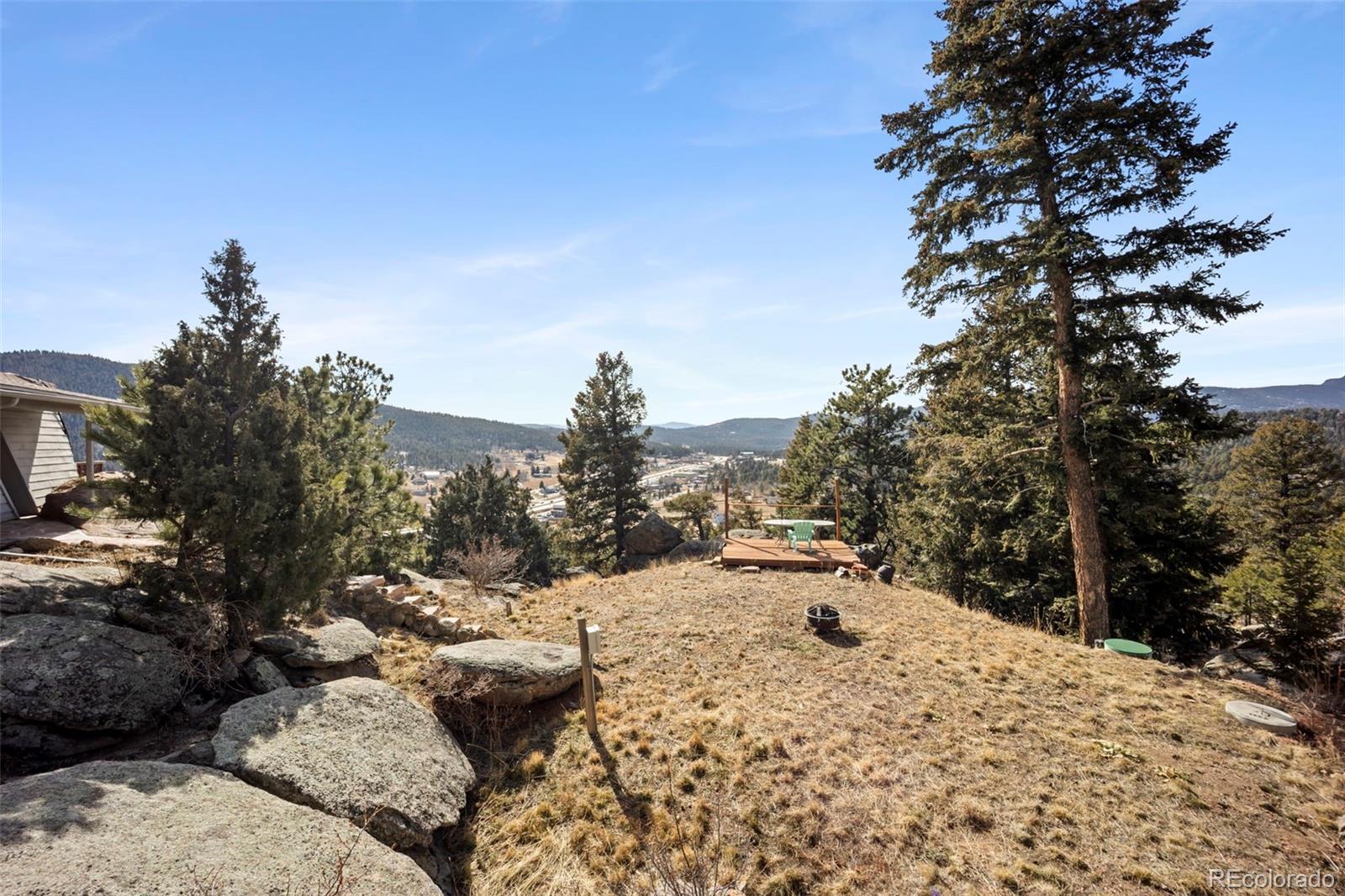 25874 Mosier Street Conifer, CO 80433 - Photo 31 of 45 a view of a backyard of the house