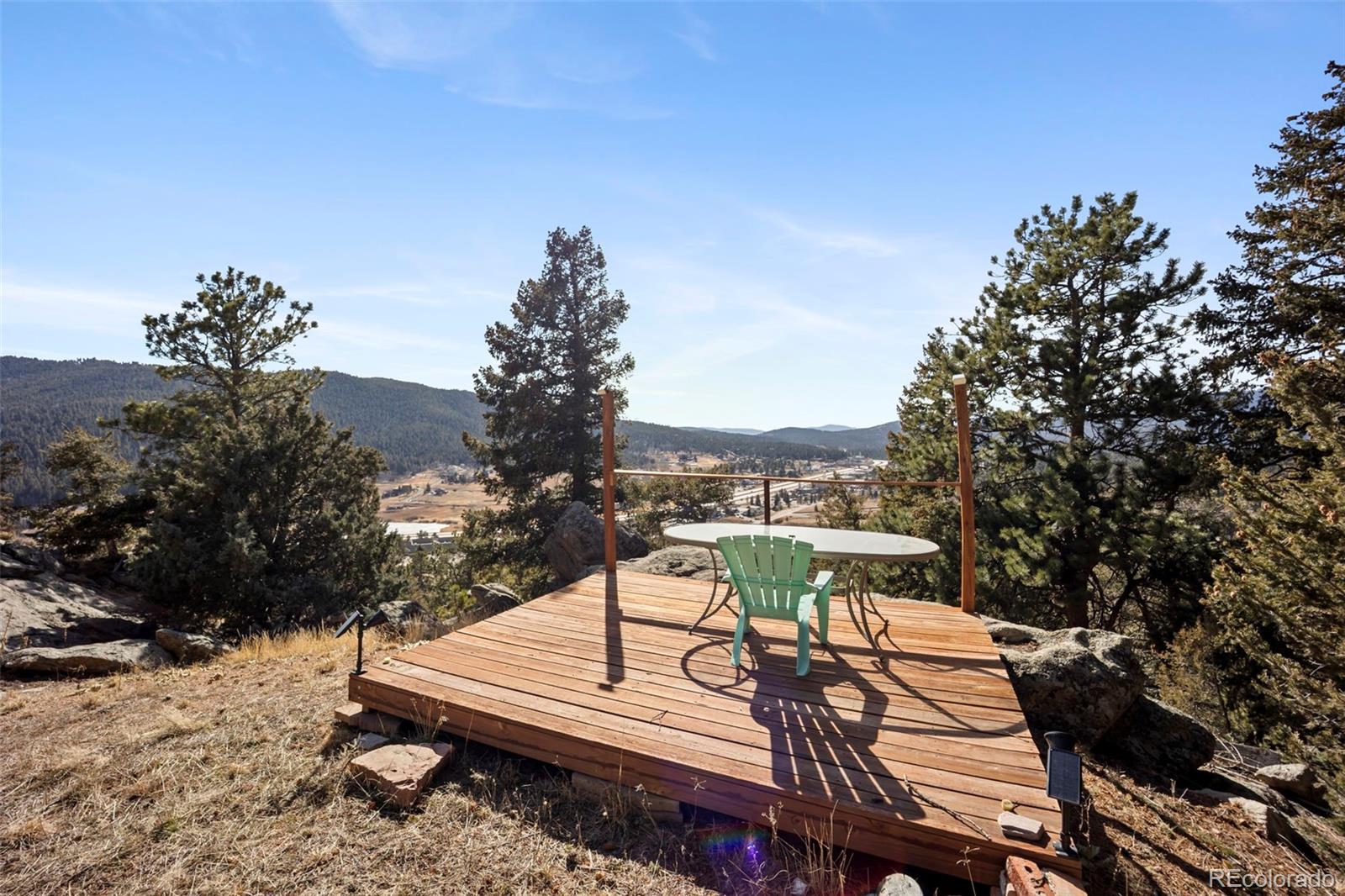 25874 Mosier Street Conifer, CO 80433 - Photo 34 of 45 a view of a terrace with furniture