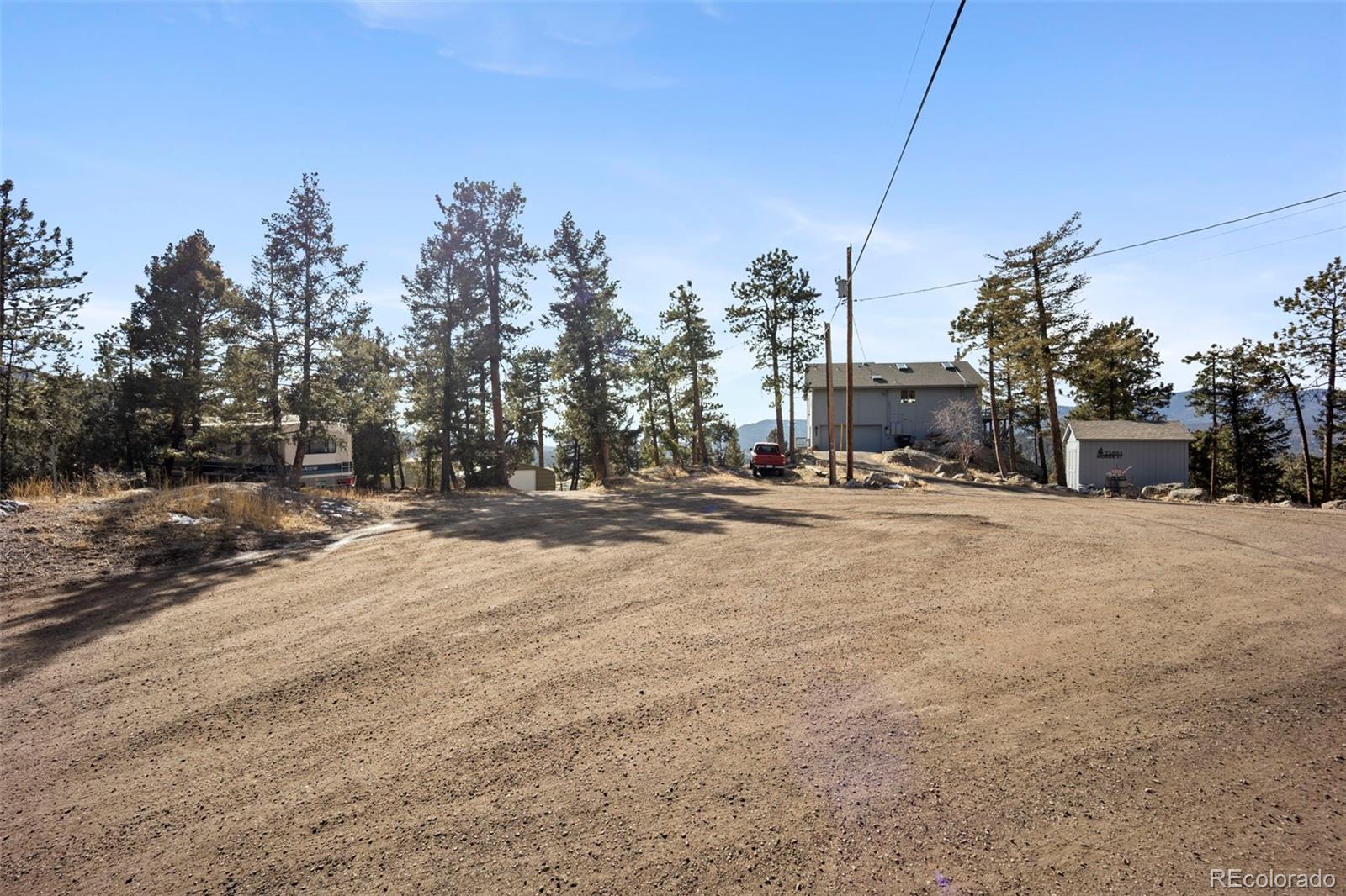 25874 Mosier Street Conifer, CO 80433 - Photo 35 of 45 a view of road with a building