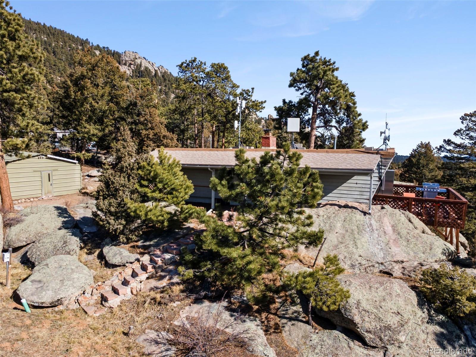 25874 Mosier Street Conifer, CO 80433 - Photo 37 of 45 a view of a garden with a fountain