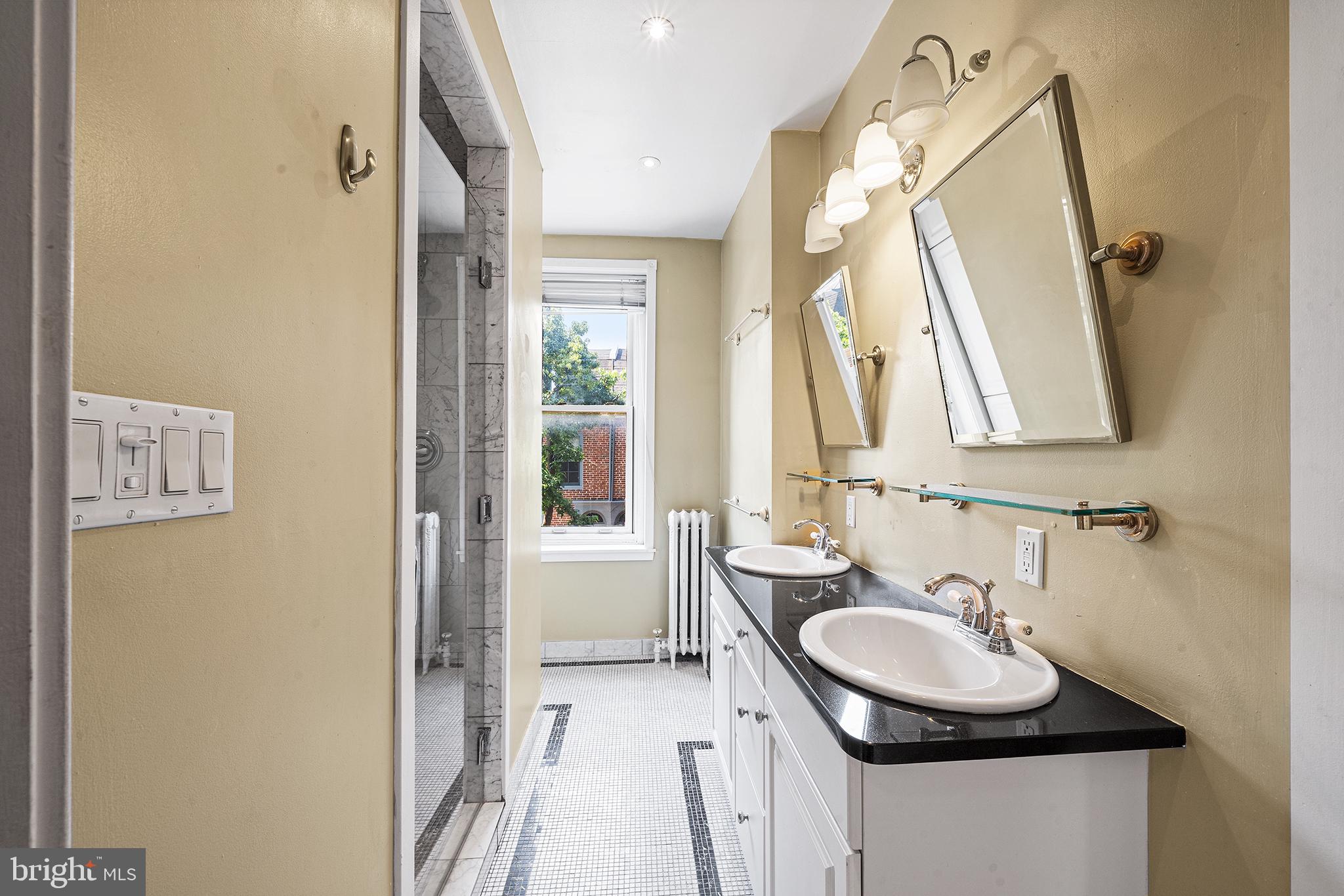231 Pine Street, Unit 2 Philadelphia, PA 19106 - Photo 13 of 23 a bathroom with a sink and a mirror