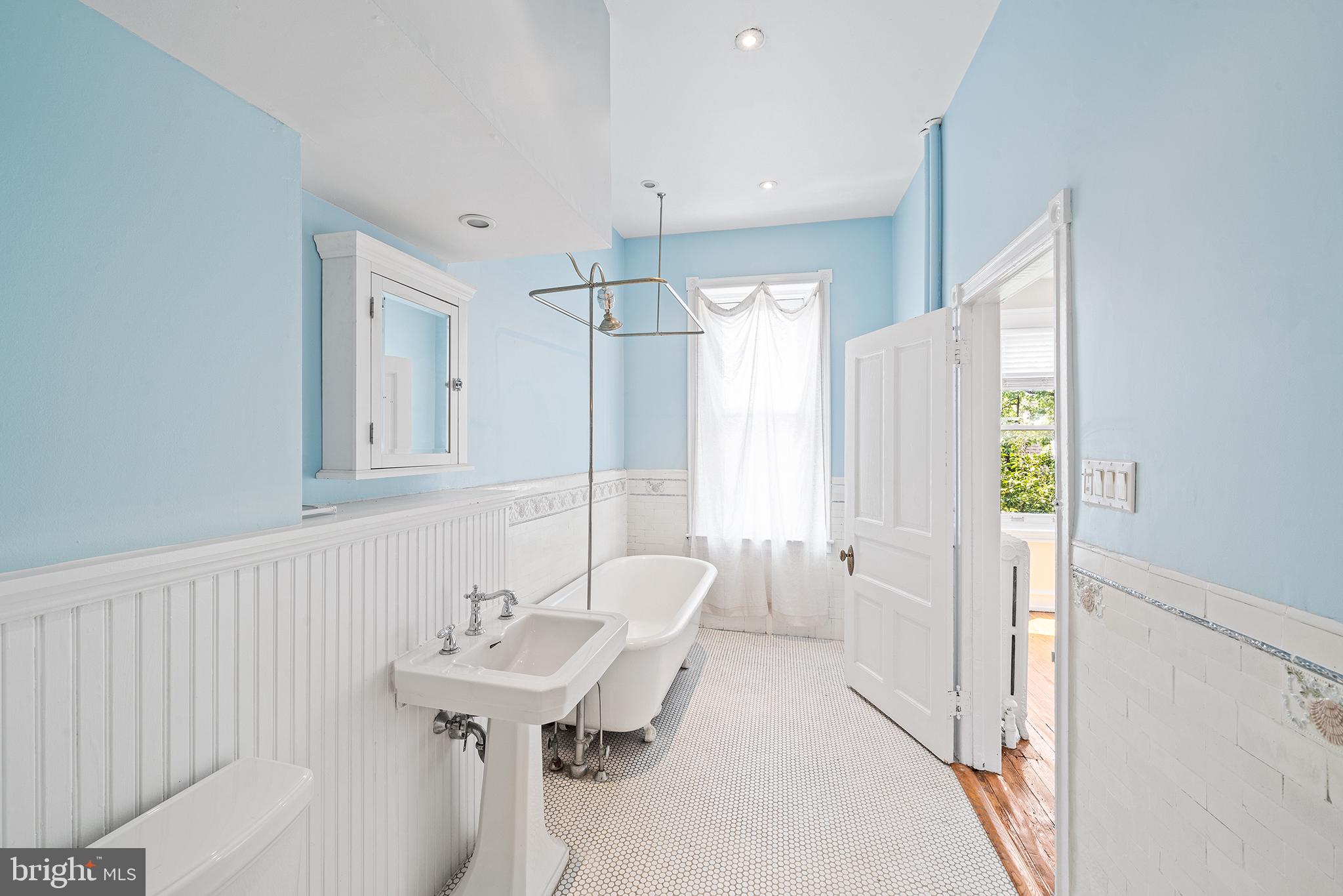231 Pine Street, Unit 2 Philadelphia, PA 19106 - Photo 23 of 23 a bathroom with a sink a mirror and a shower