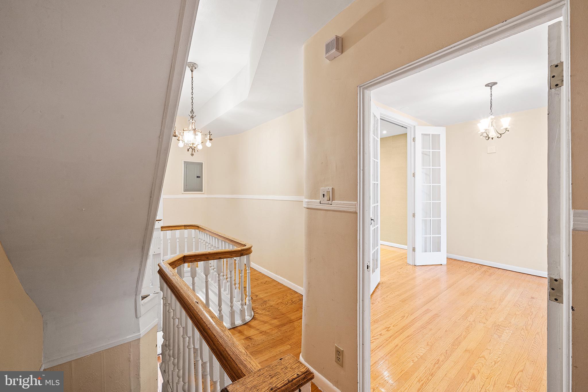231 Pine Street, Unit 2 Philadelphia, PA 19106 - Photo 7 of 23 a view of a hallway with wooden floor and staircase