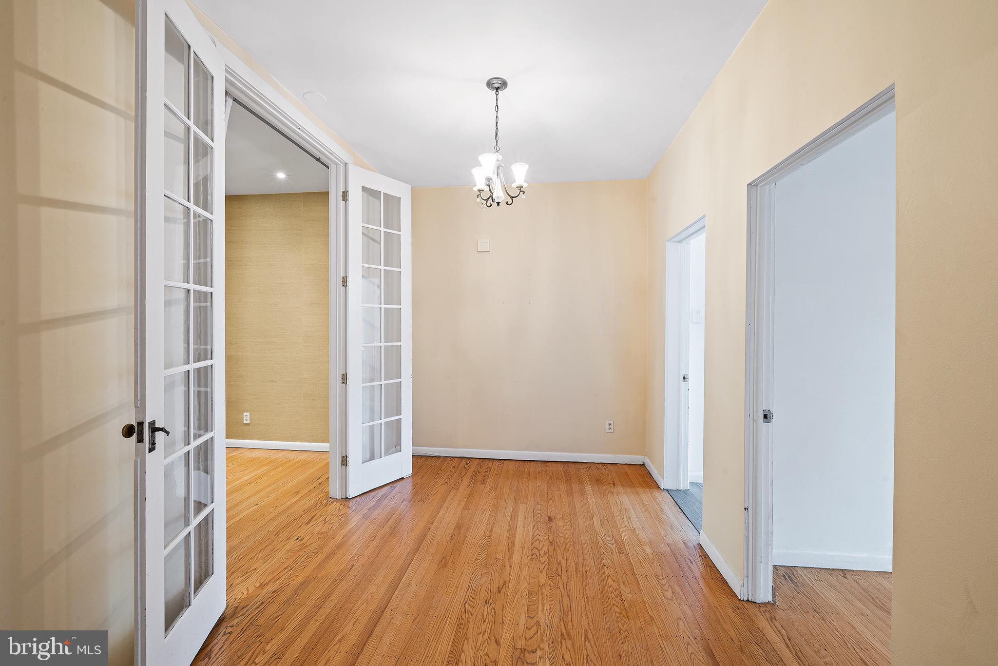 231 Pine Street, Unit 2 Philadelphia, PA 19106 - Photo 8 of 23 wooden floor in an empty room with a window