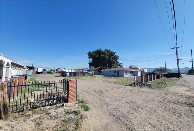 a view of a wrought iron fences in front of house