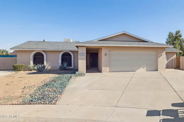 a front view of a house with yard