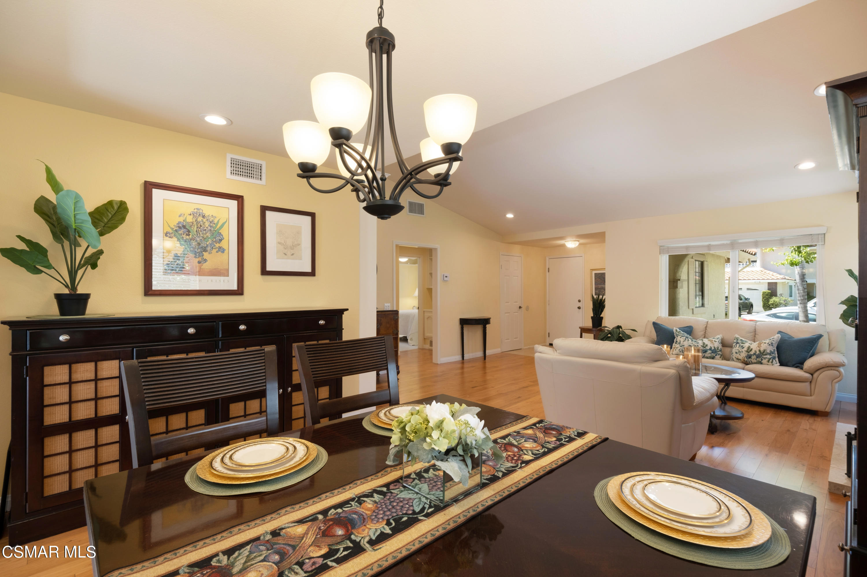 19358 Crystal Ridge Lane Porter Ranch, CA 91326 - Photo 12 of 37 a living room with furniture and a chandelier
