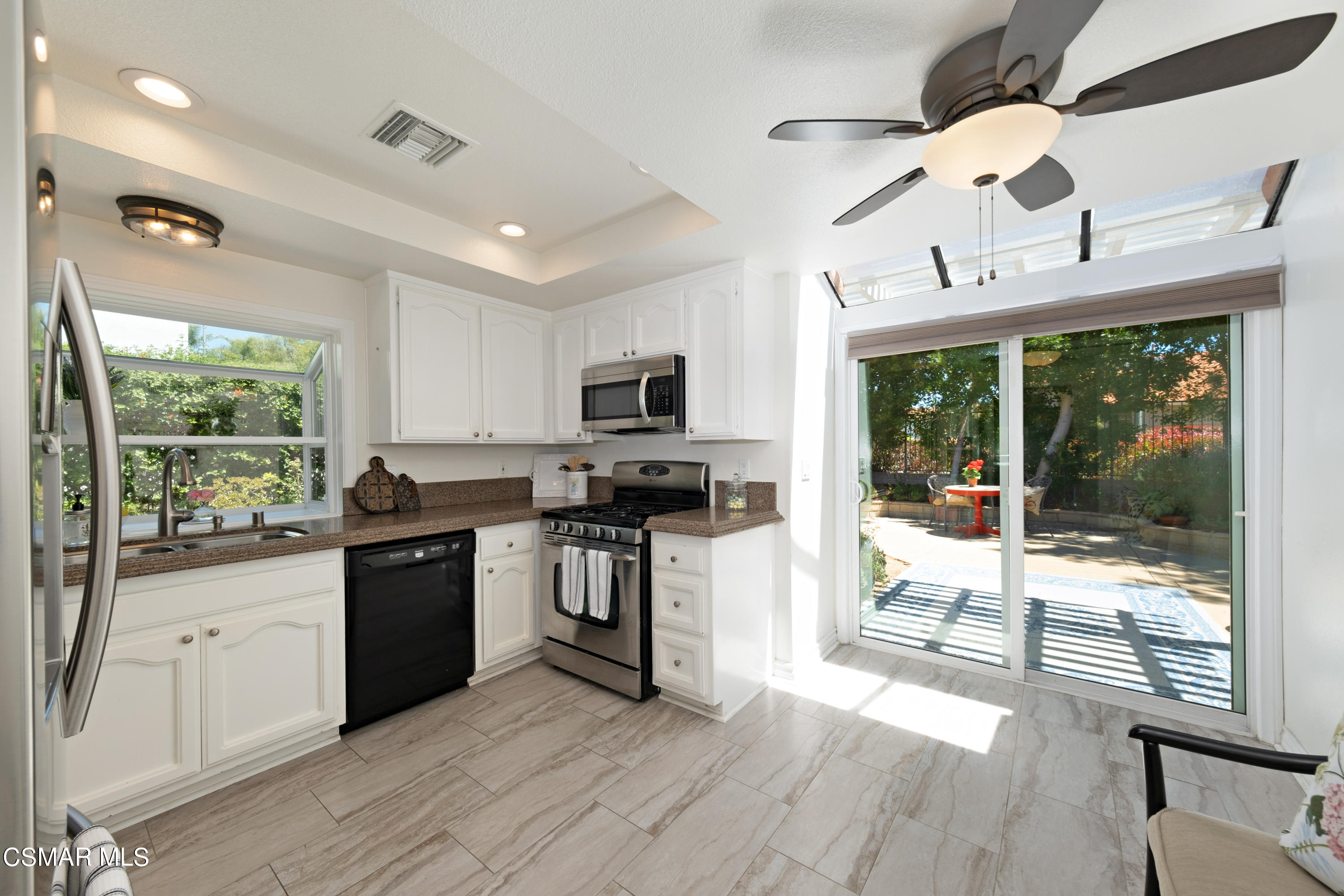 19358 Crystal Ridge Lane Porter Ranch, CA 91326 - Photo 13 of 37 a kitchen with stainless steel appliances granite countertop a stove and a sink