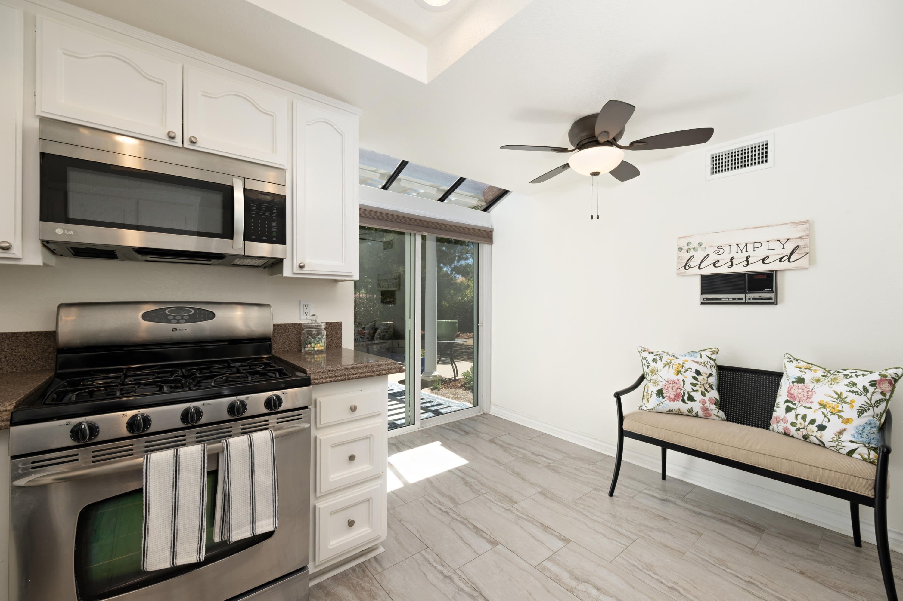 19358 Crystal Ridge Lane Porter Ranch, CA 91326 - Photo 15 of 37 a kitchen with stainless steel appliances a stove a microwave and cabinets