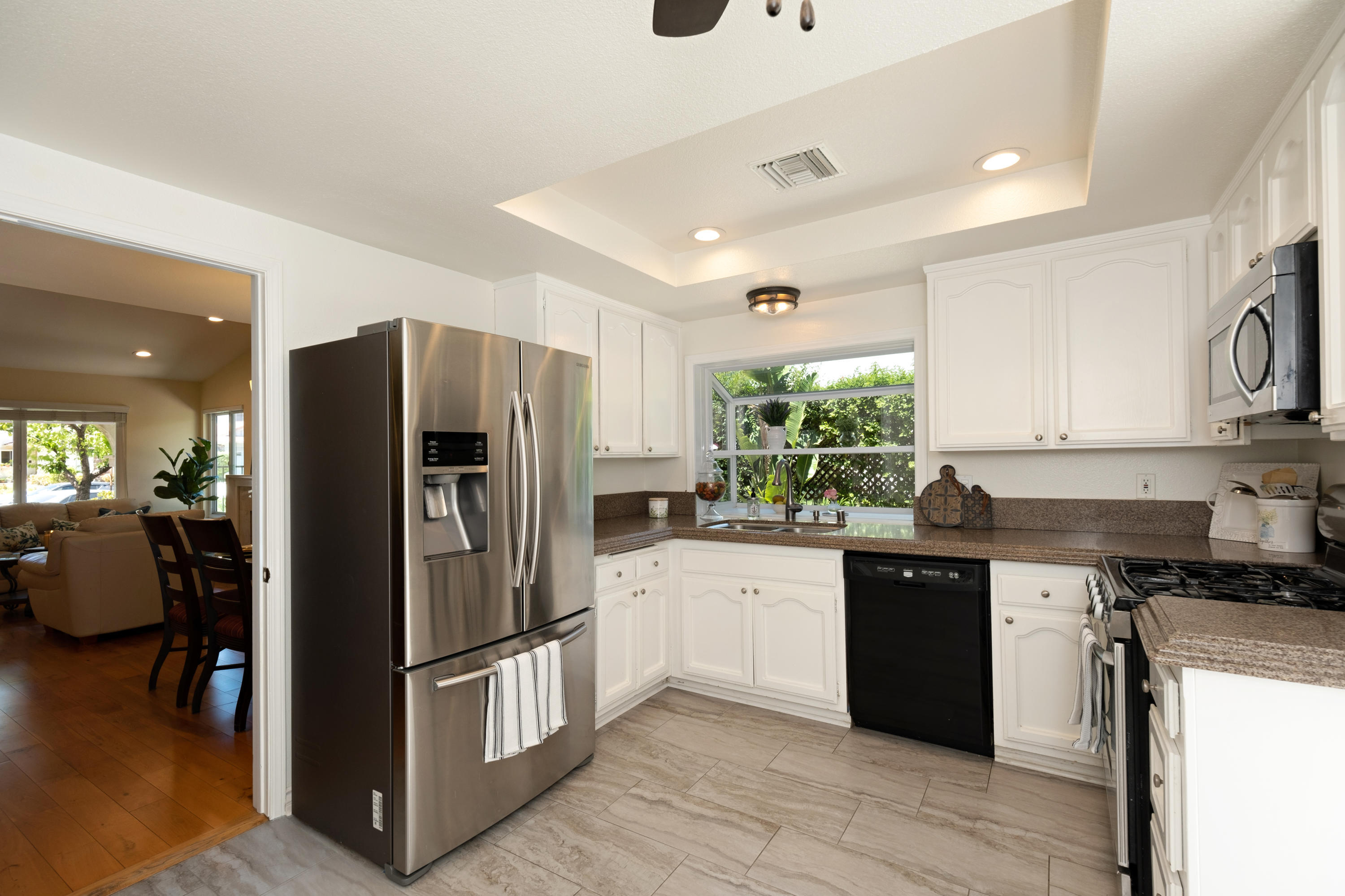 19358 Crystal Ridge Lane Porter Ranch, CA 91326 - Photo 16 of 37 a kitchen with stainless steel appliances granite countertop a refrigerator stove and sink