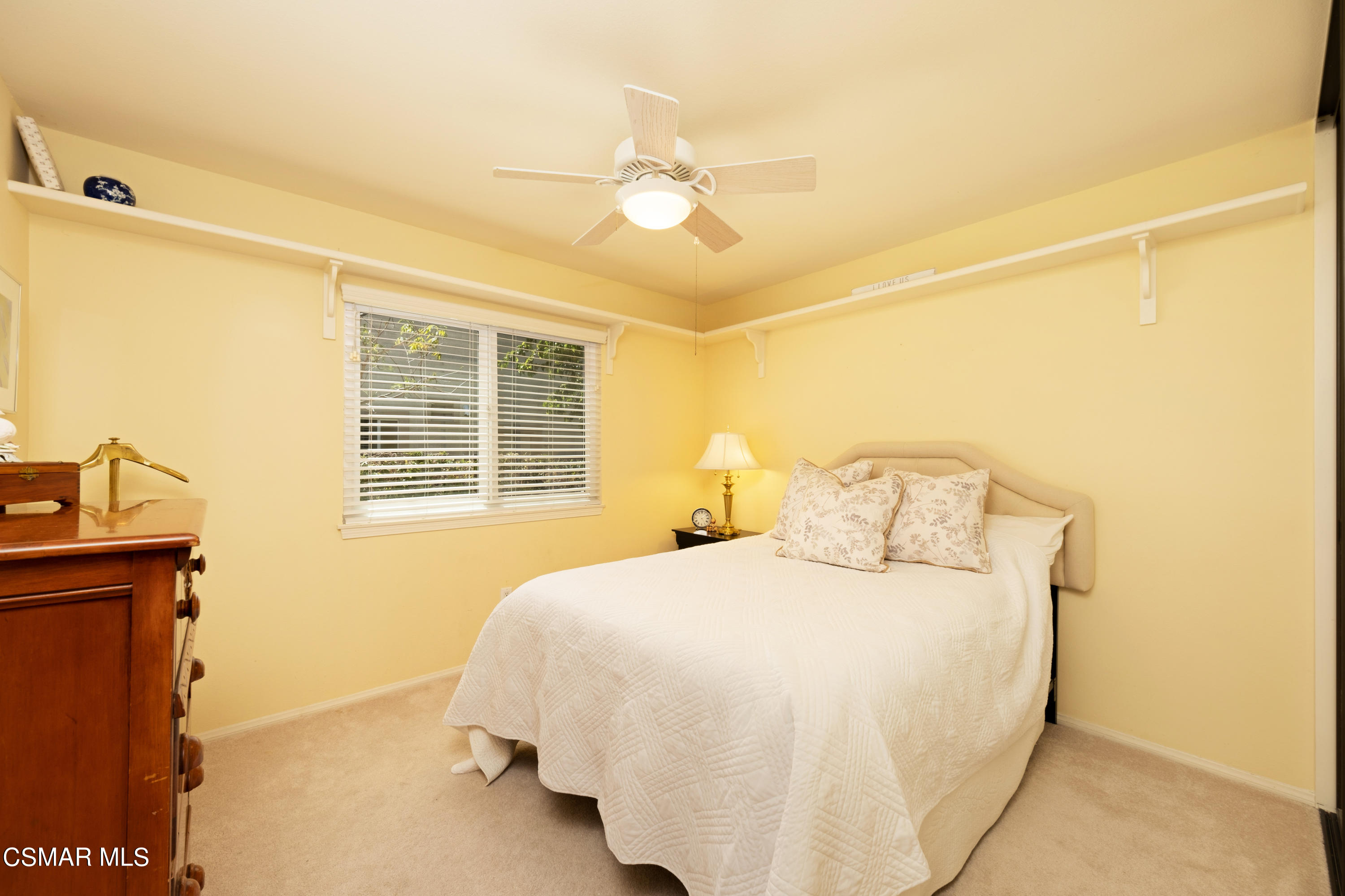 19358 Crystal Ridge Lane Porter Ranch, CA 91326 - Photo 17 of 37 a bedroom with a bed and a window