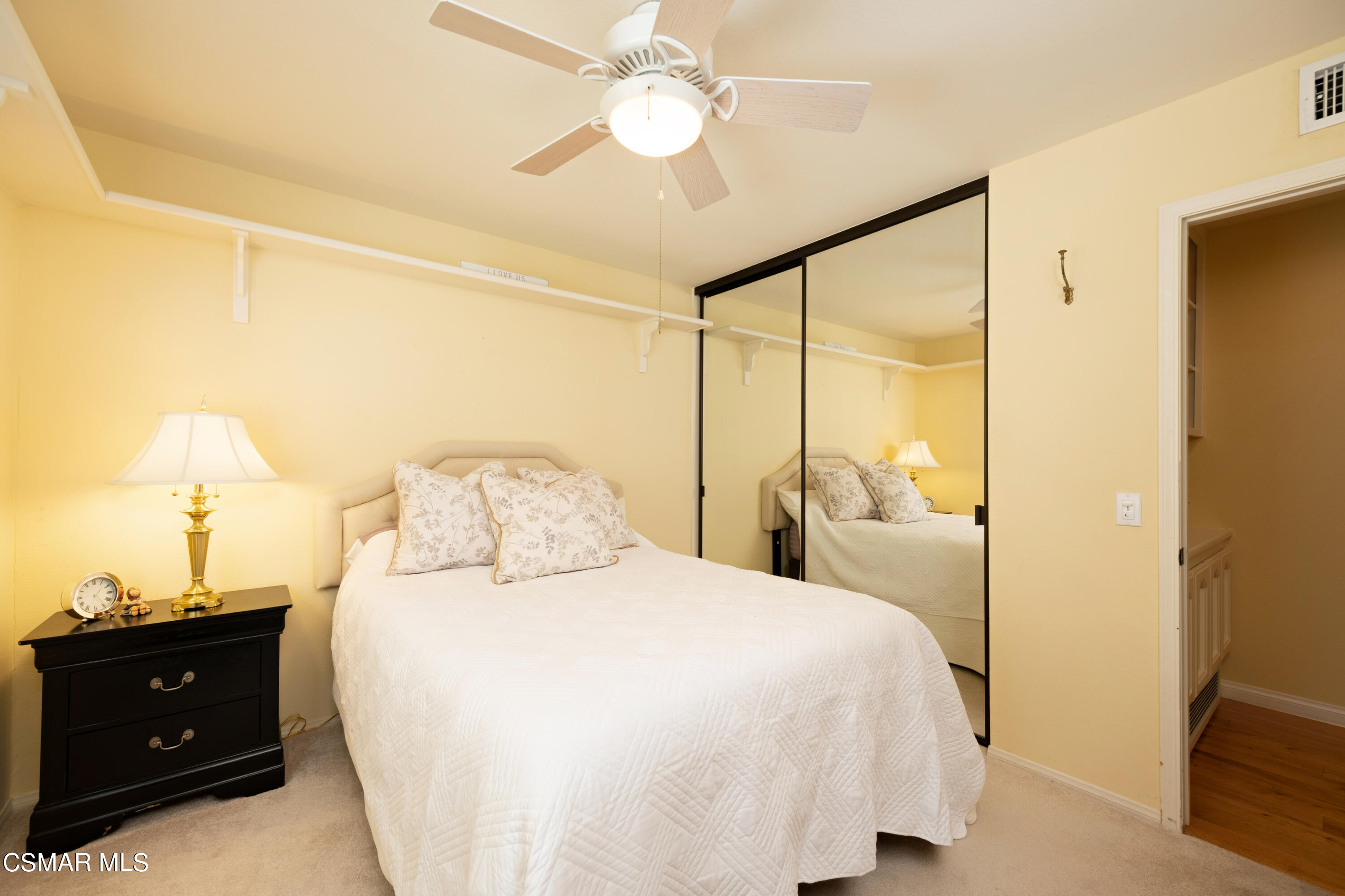 19358 Crystal Ridge Lane Porter Ranch, CA 91326 - Photo 18 of 37 a bedroom with a bed and a night stand