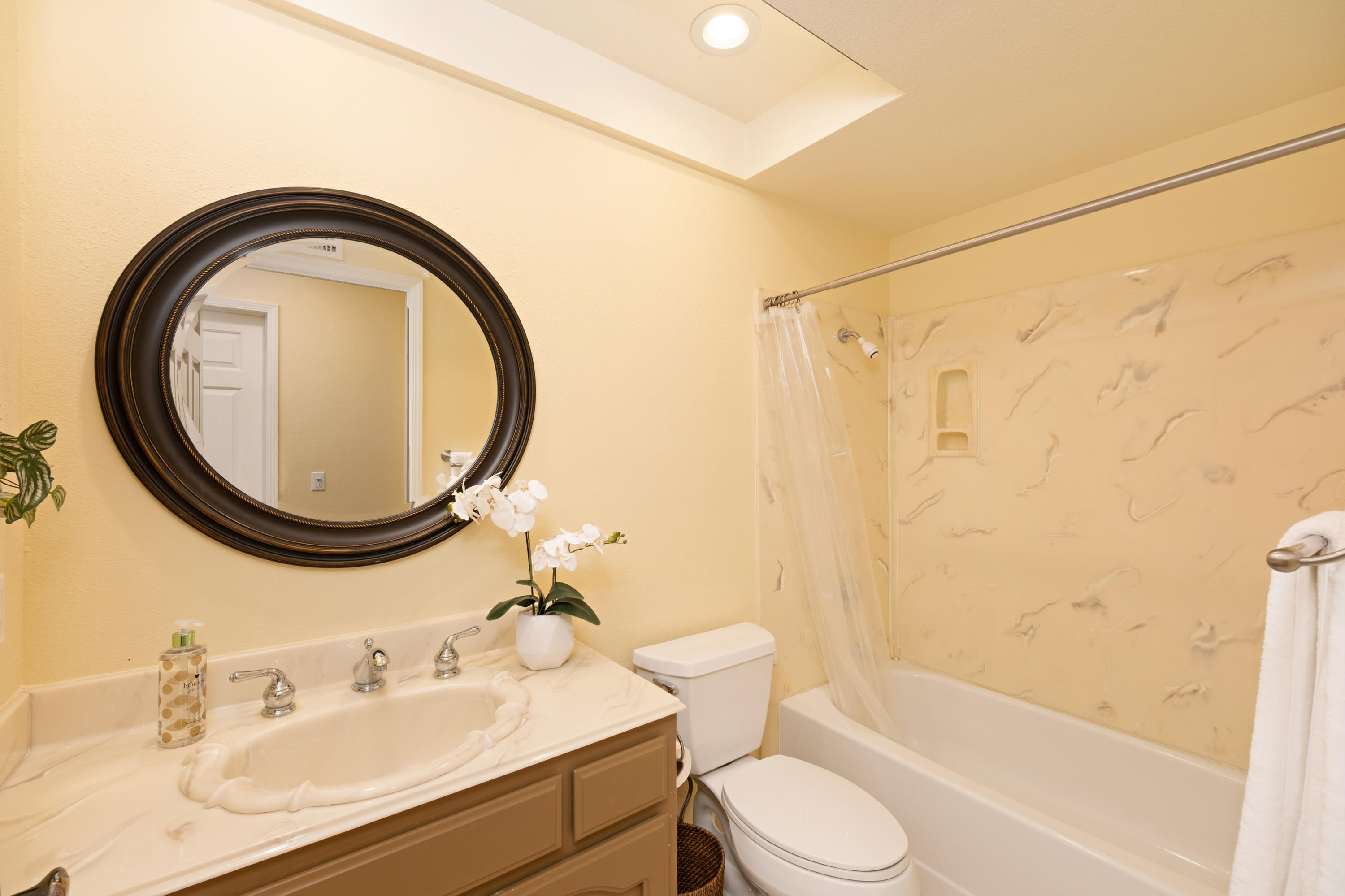 19358 Crystal Ridge Lane Porter Ranch, CA 91326 - Photo 22 of 37 a bathroom with a sink a toilet and a mirror