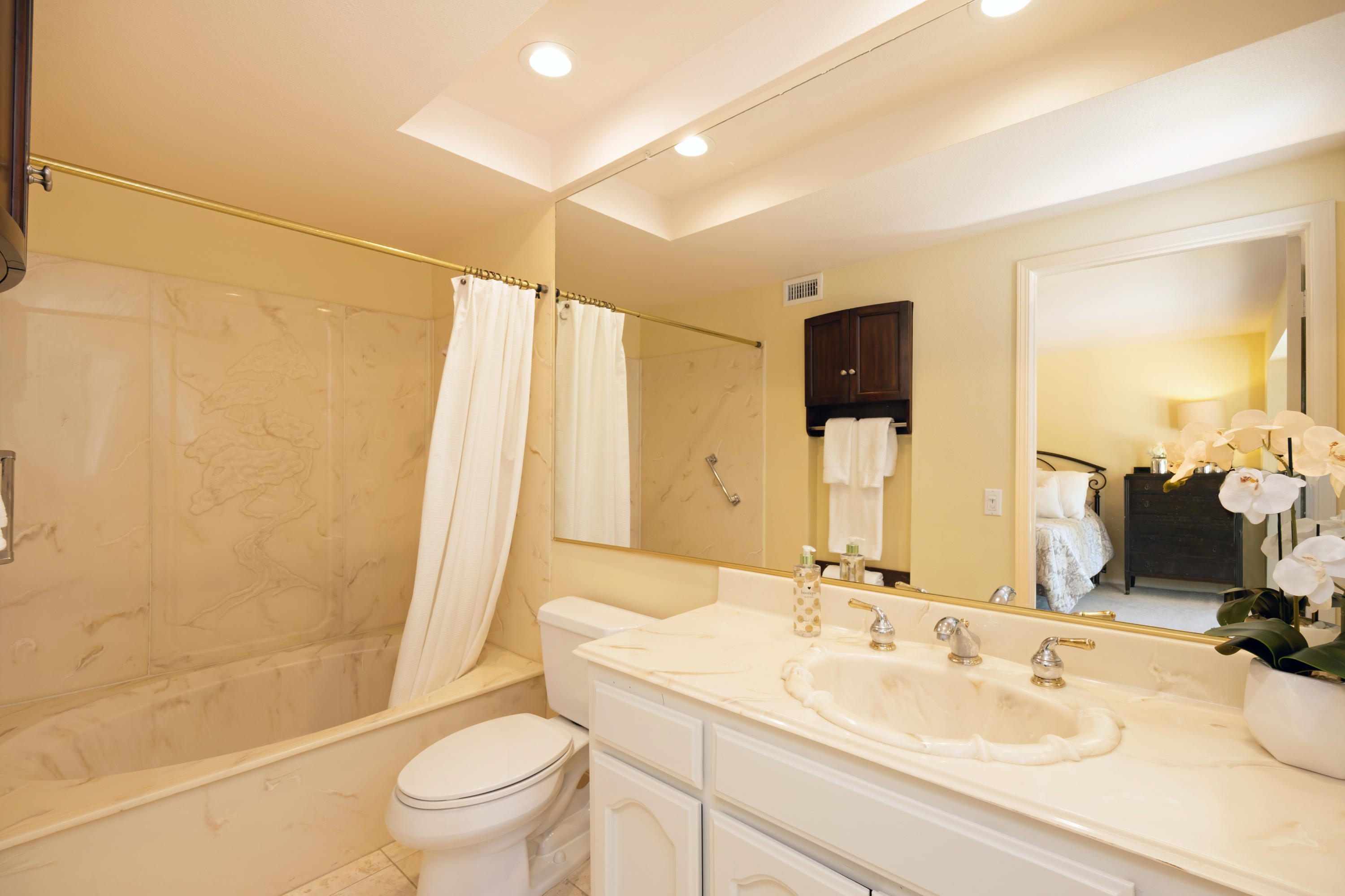 19358 Crystal Ridge Lane Porter Ranch, CA 91326 - Photo 23 of 37 a bathroom with a sink a toilet and shower