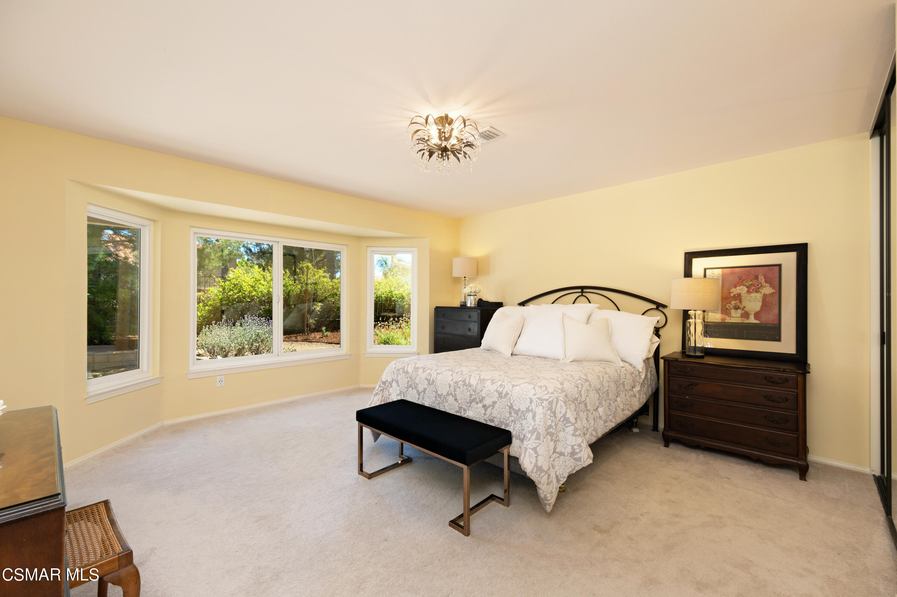 19358 Crystal Ridge Lane Porter Ranch, CA 91326 - Photo 26 of 37 a spacious bedroom with a bed and window