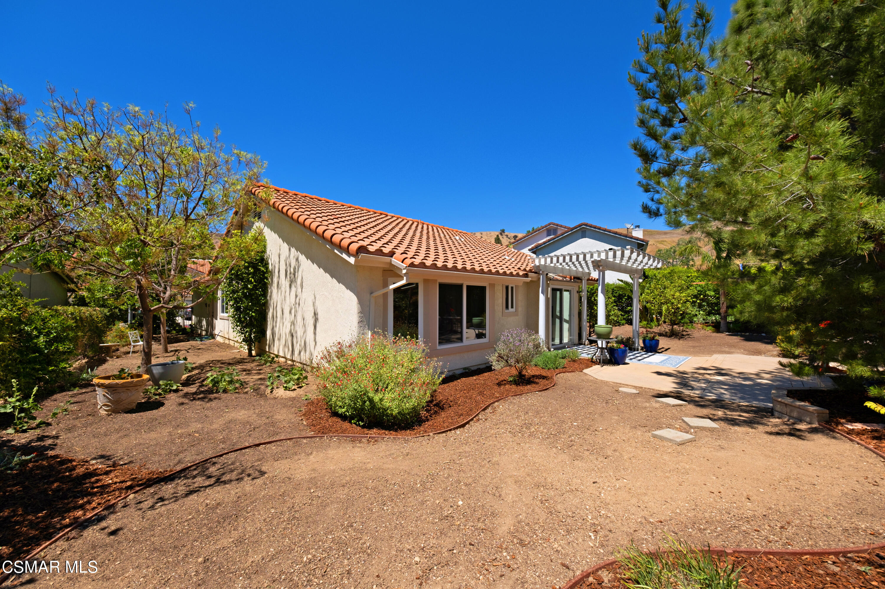 19358 Crystal Ridge Lane Porter Ranch, CA 91326 - Photo 27 of 37 a view of a house with backyard and sitting area