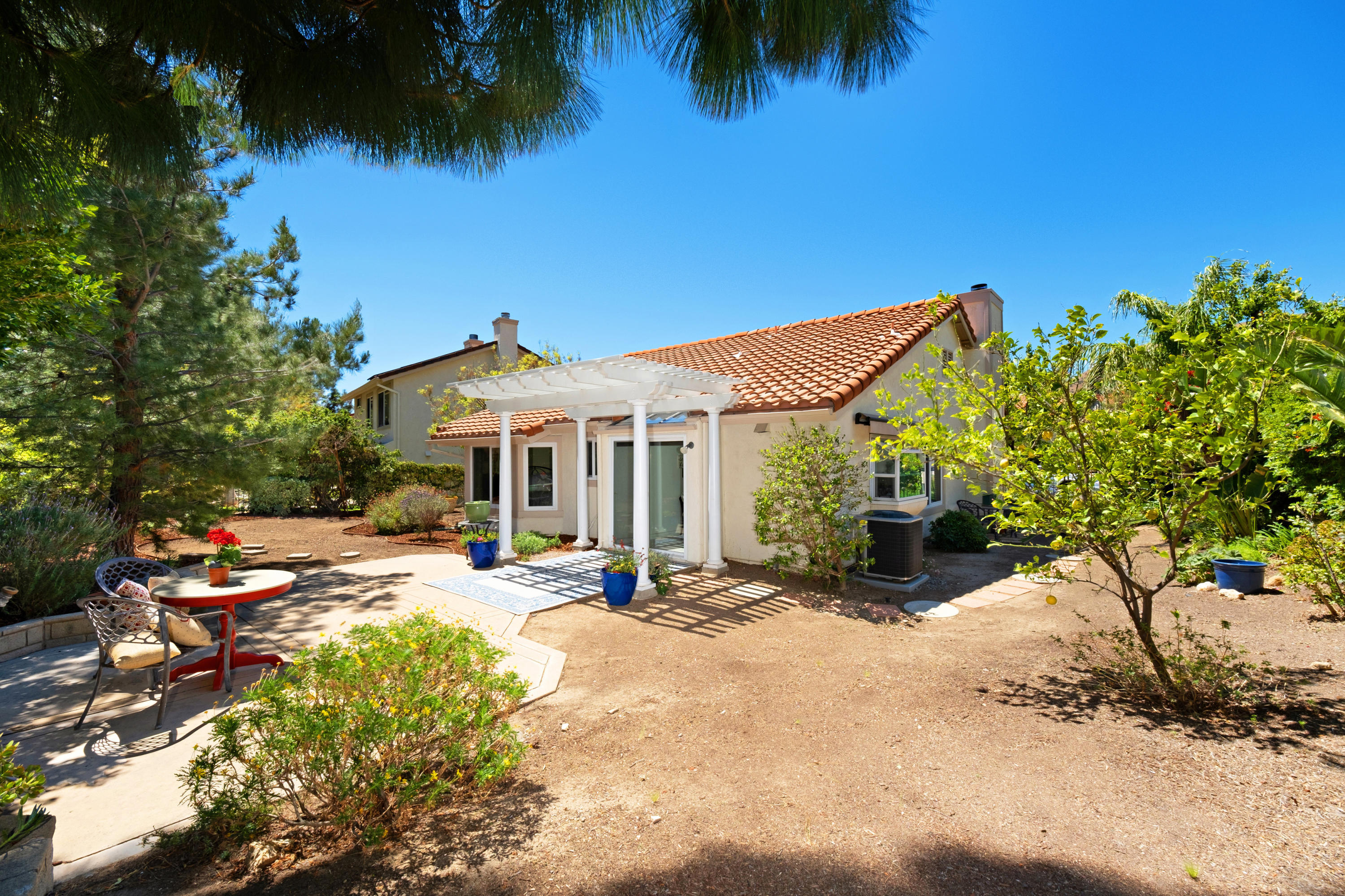 19358 Crystal Ridge Lane Porter Ranch, CA 91326 - Photo 31 of 37 a view of a patio with swimming pool table and chairs
