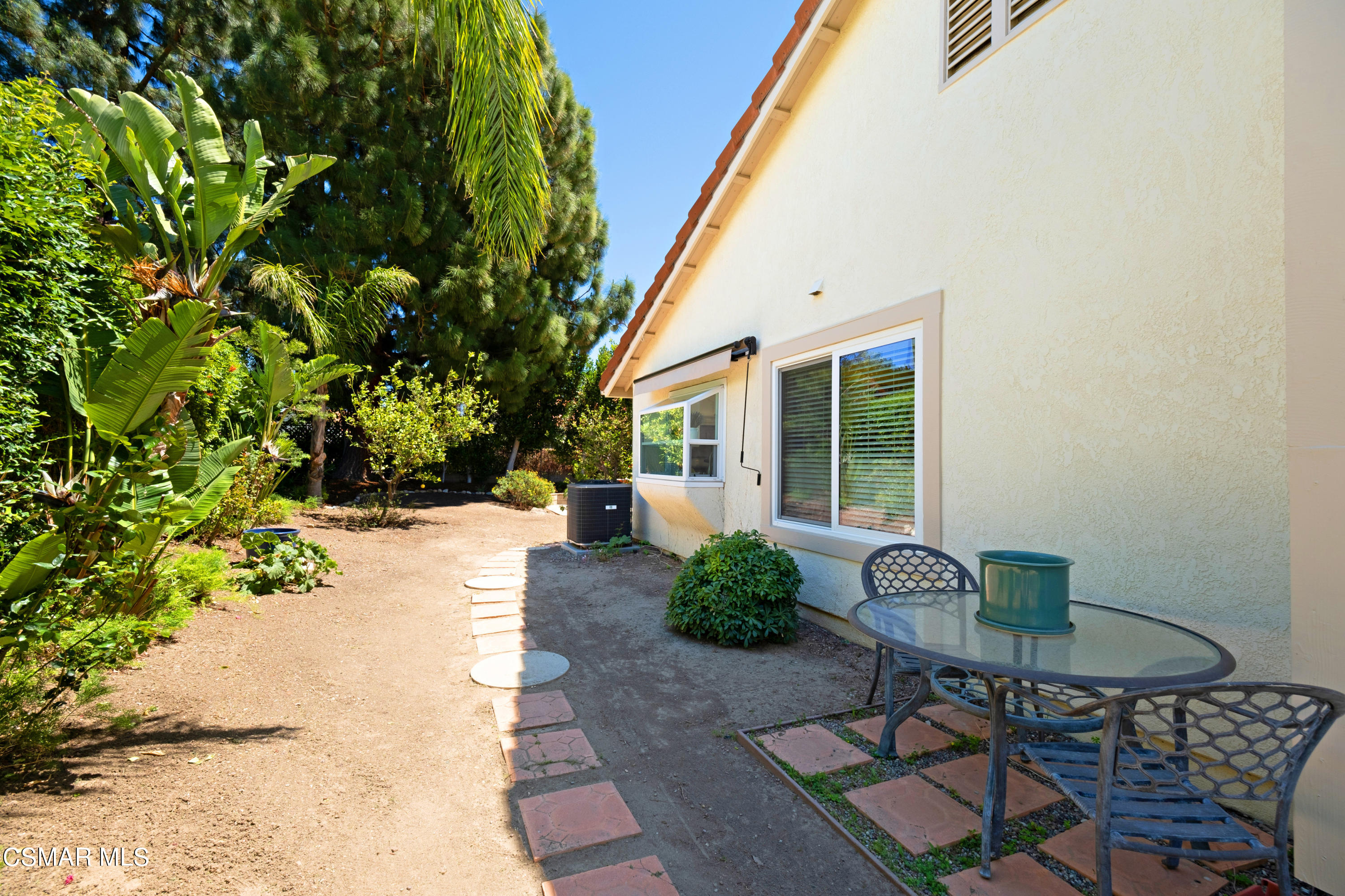 19358 Crystal Ridge Lane Porter Ranch, CA 91326 - Photo 33 of 37 a view of a chair and table in backyard of the house