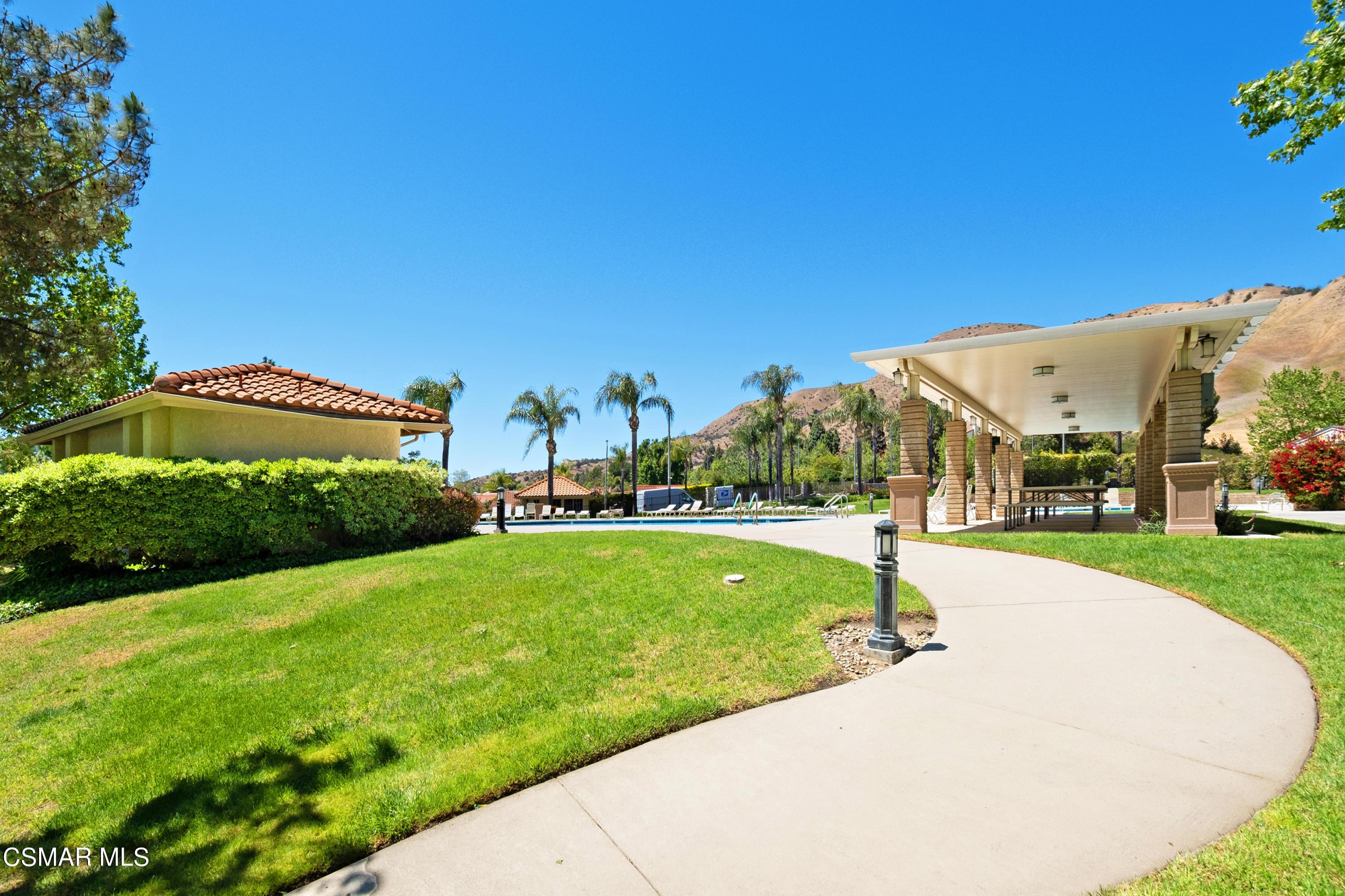 19358 Crystal Ridge Lane Porter Ranch, CA 91326 - Photo 35 of 37 a view of a garden with a building in the background