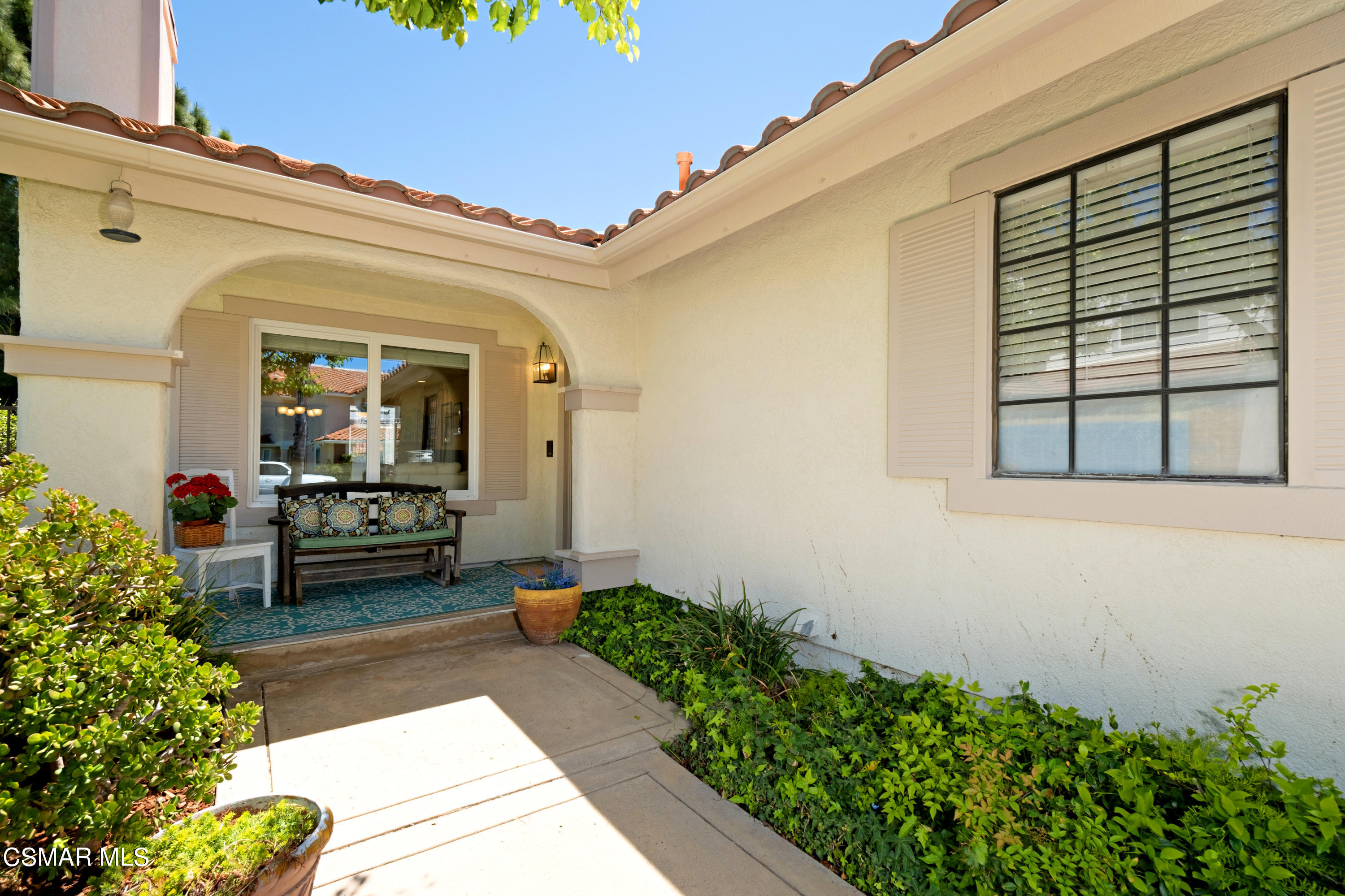 19358 Crystal Ridge Lane Porter Ranch, CA 91326 - Photo 5 of 37 a front view of a house with a porch