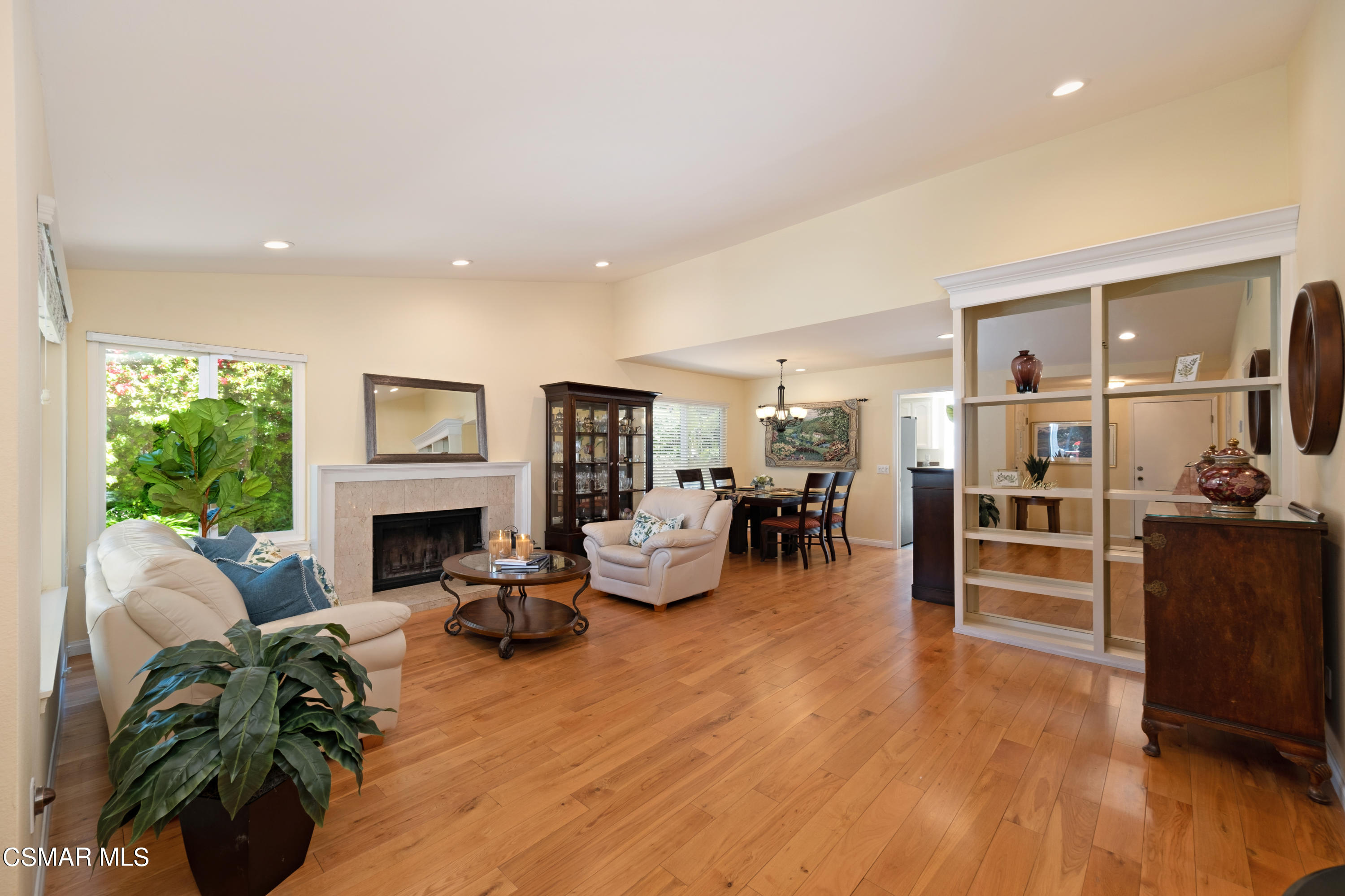 19358 Crystal Ridge Lane Porter Ranch, CA 91326 - Photo 6 of 37 a living room with furniture fireplace and potted plant